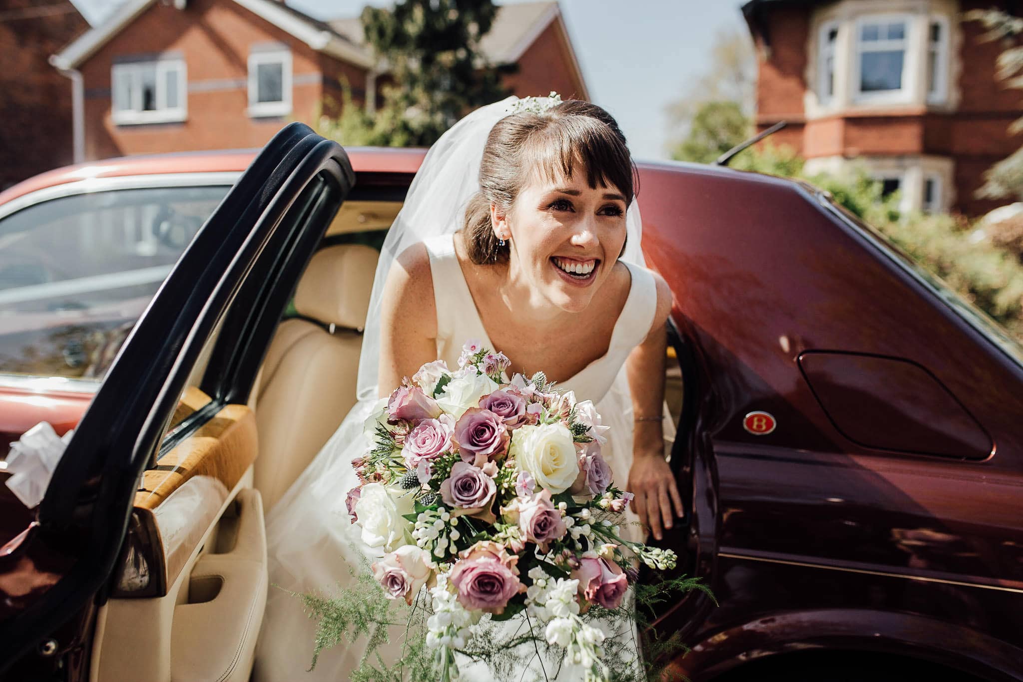 smiling bride arrives at the church