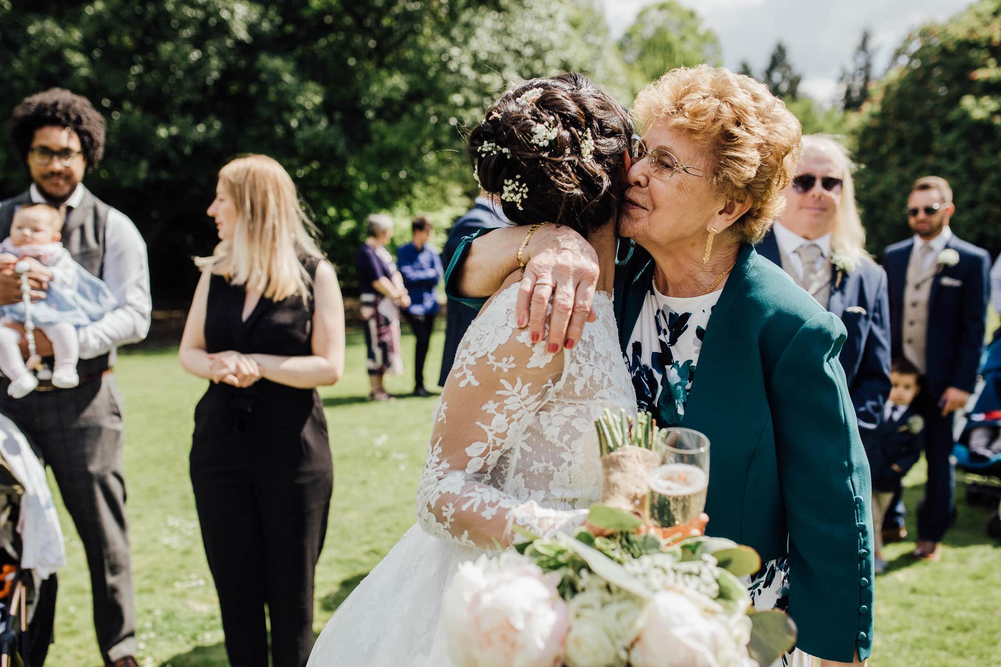 bride cuddling grandma