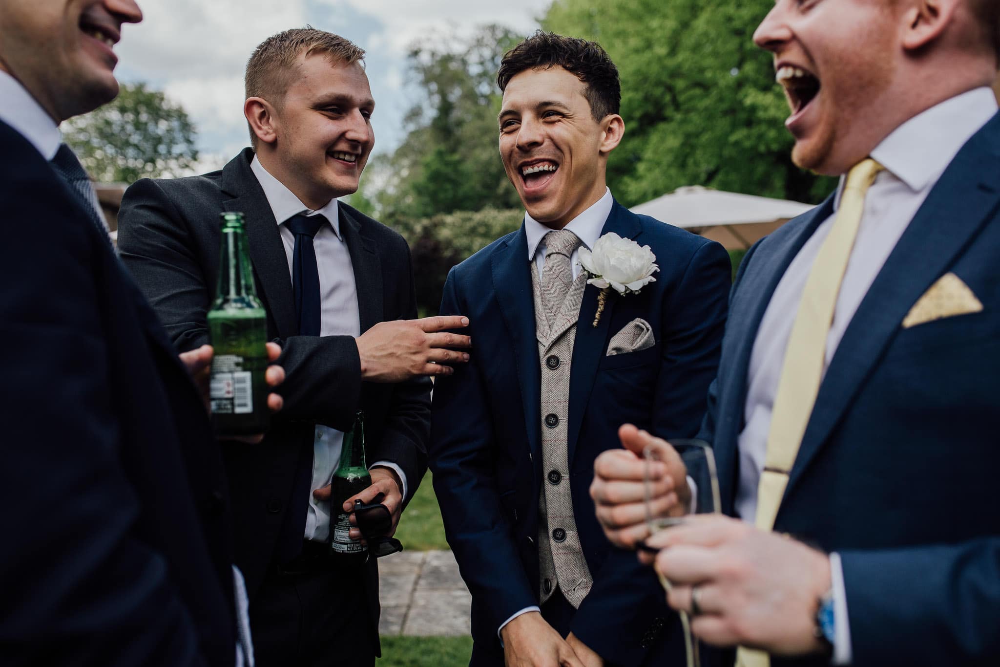 groom laughing with friends
