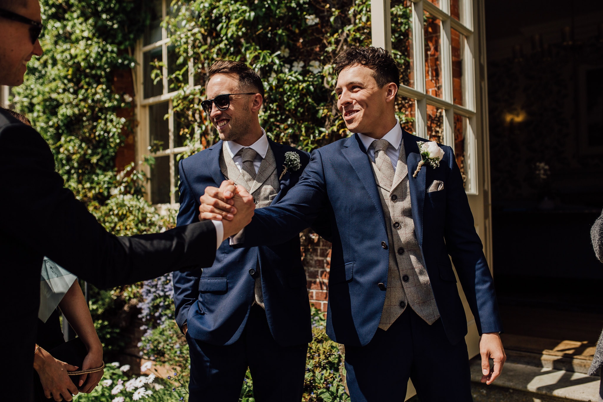 groom greets guests at Lainston House wedding