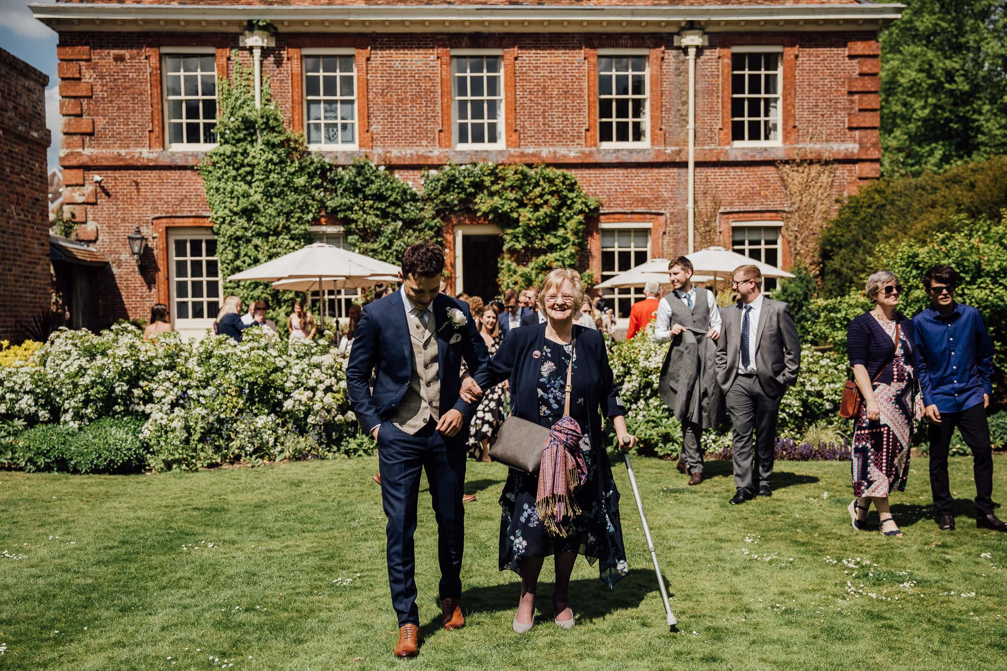 groom escorts his Grandma to Lainston House ceremony