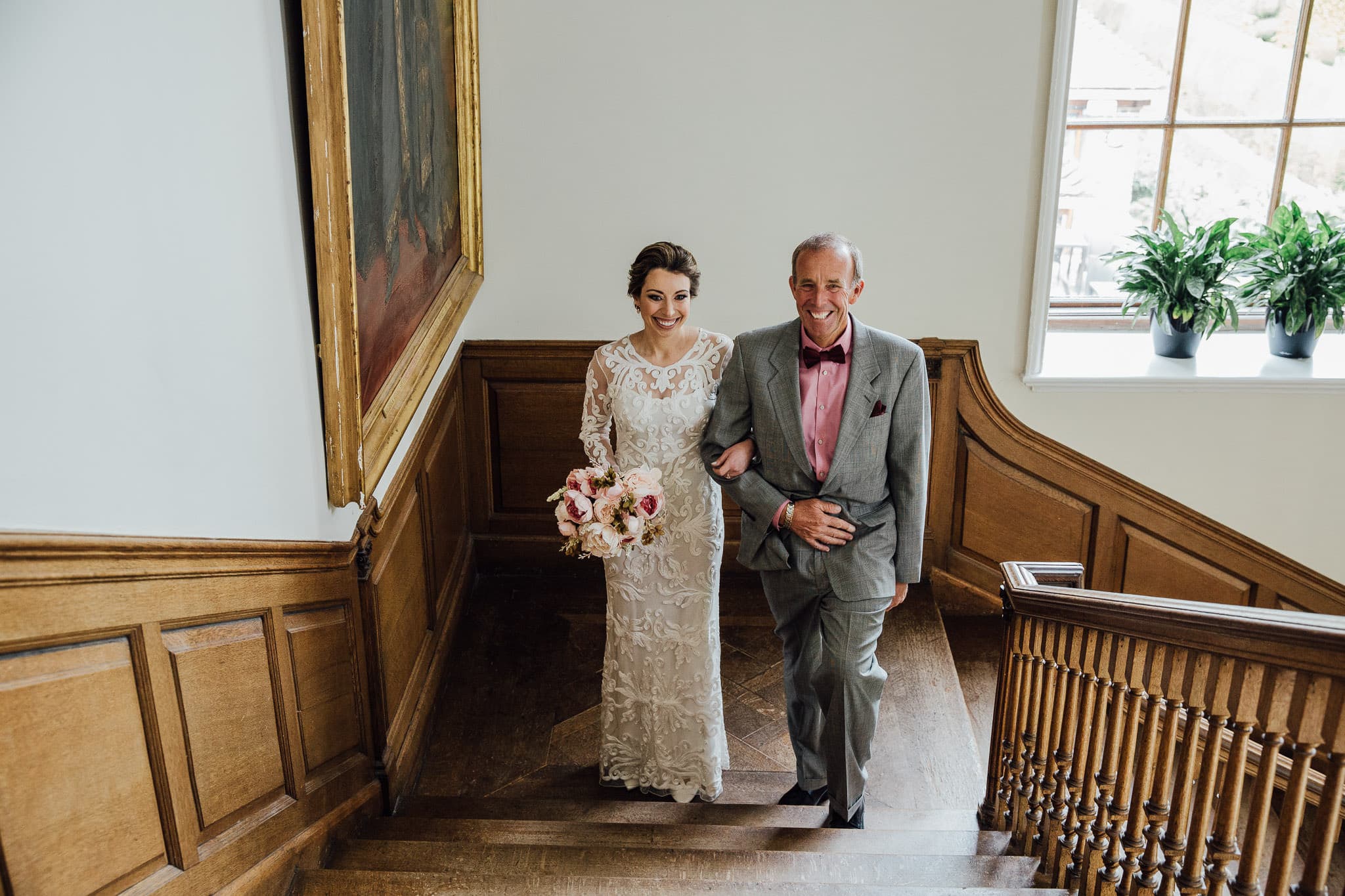 bride on staircase at Madingley Hall