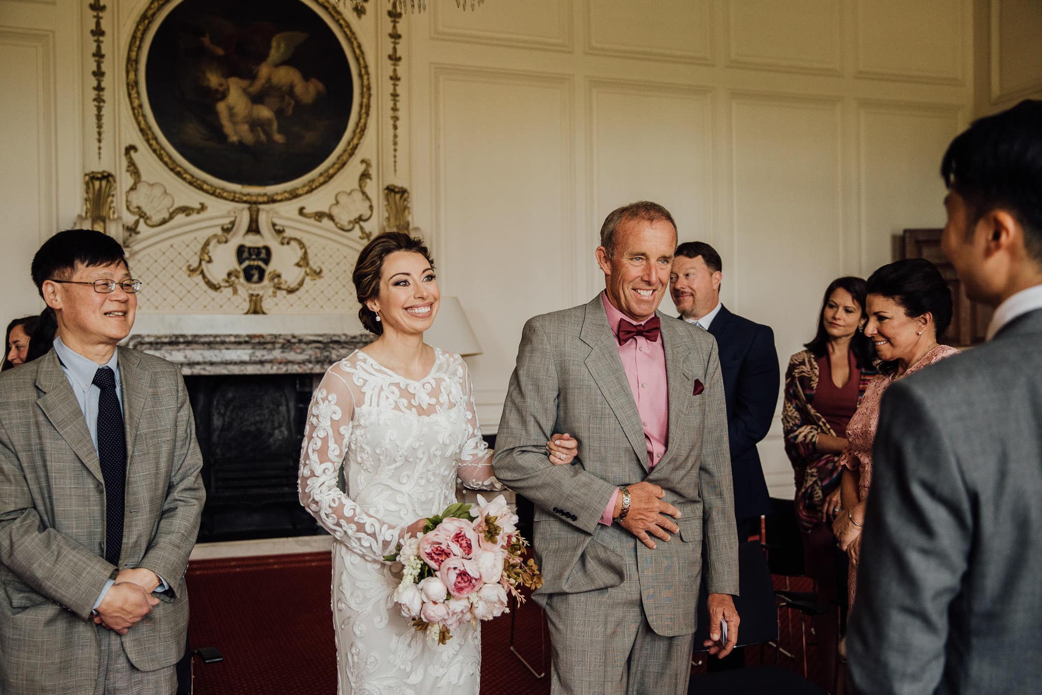 bride's entrance to ceremony at Madingley Hall Cambridge