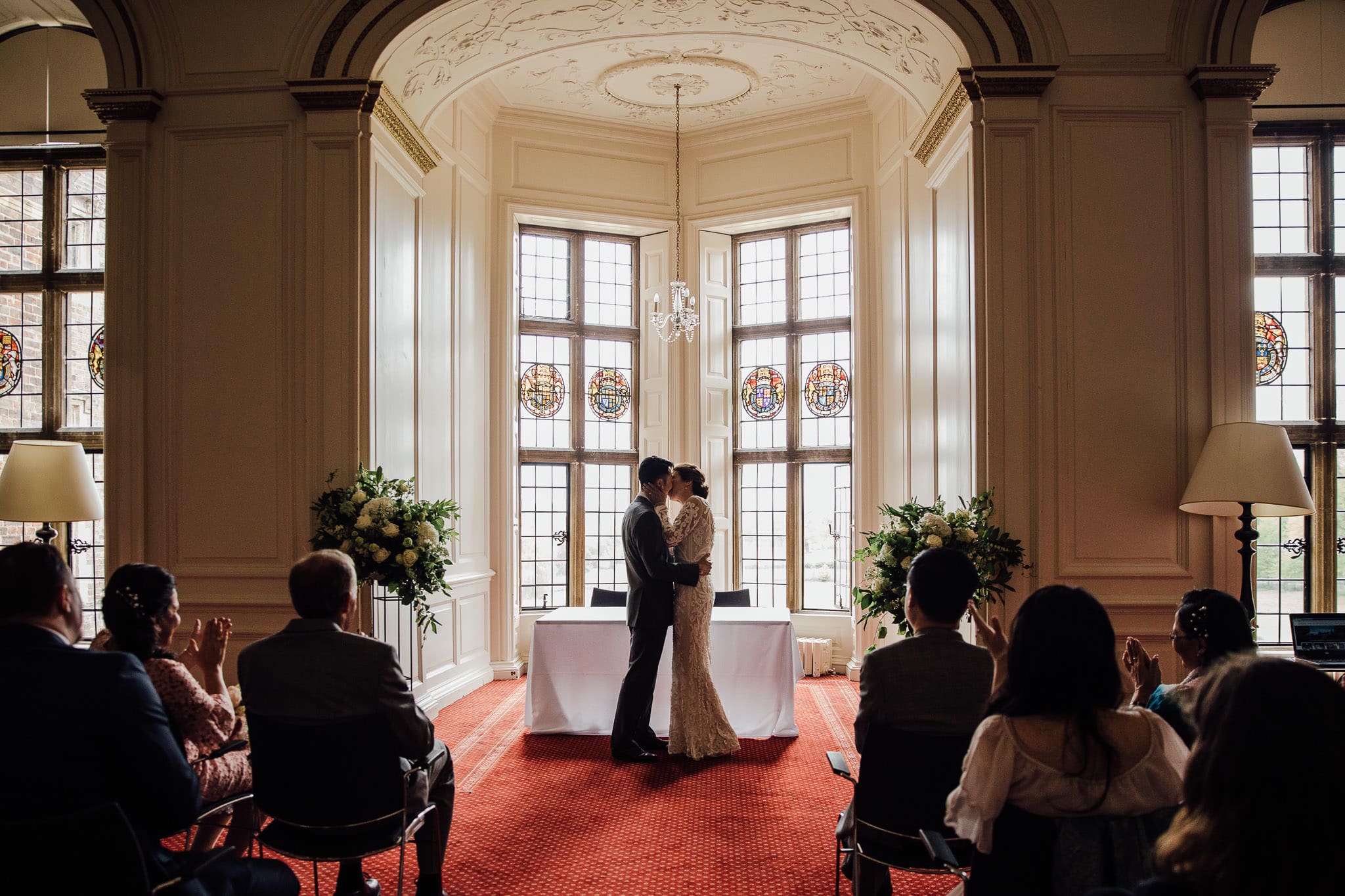 first kiss at Madingley Hall Cambridge wedding