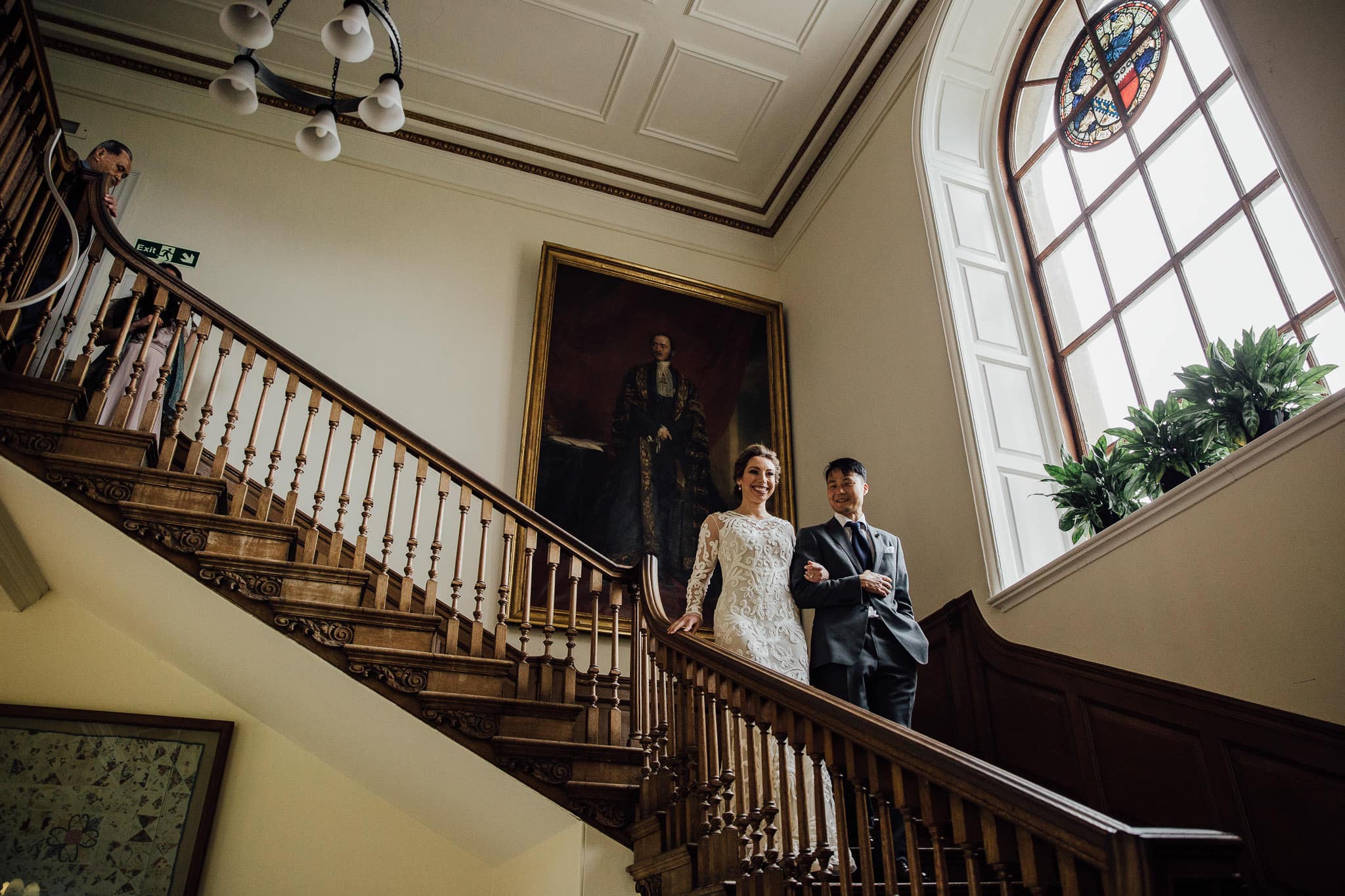 bride and groom on grand staircase