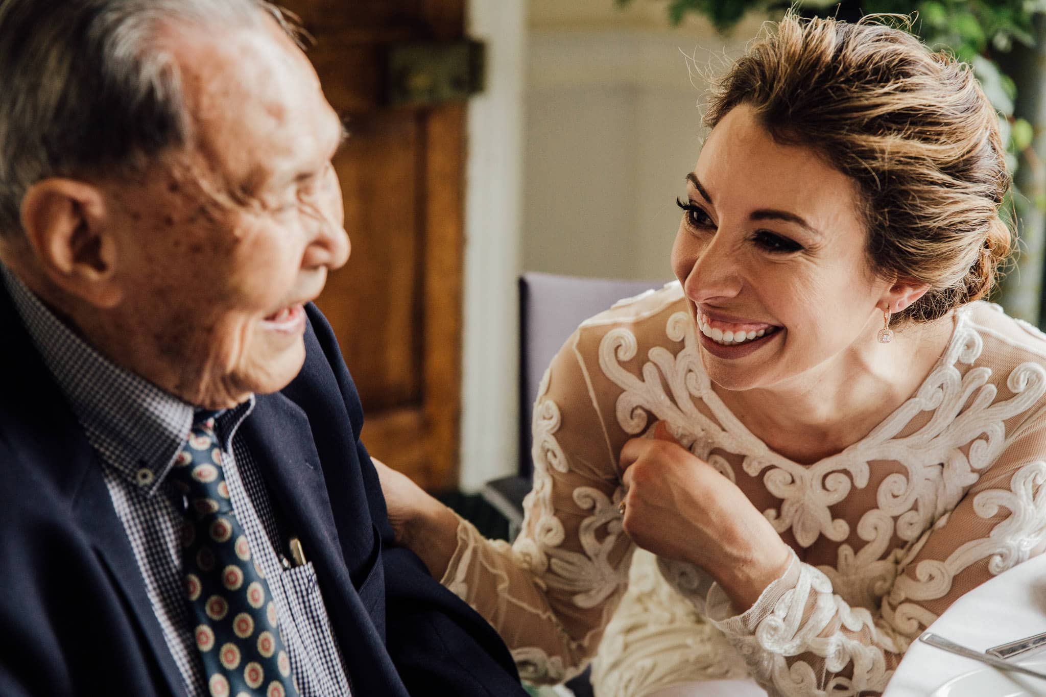 bride and grandfather laughing