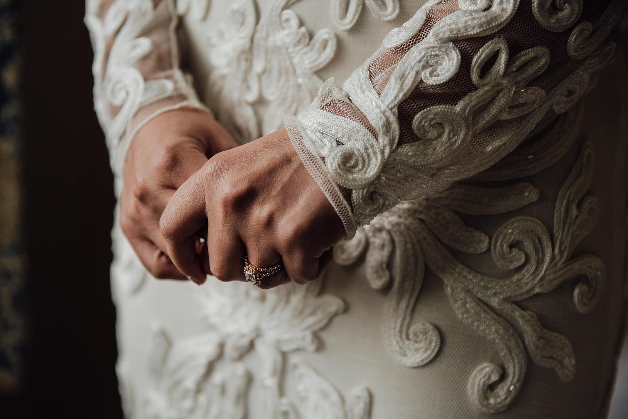 bride in long-sleeved lace dress