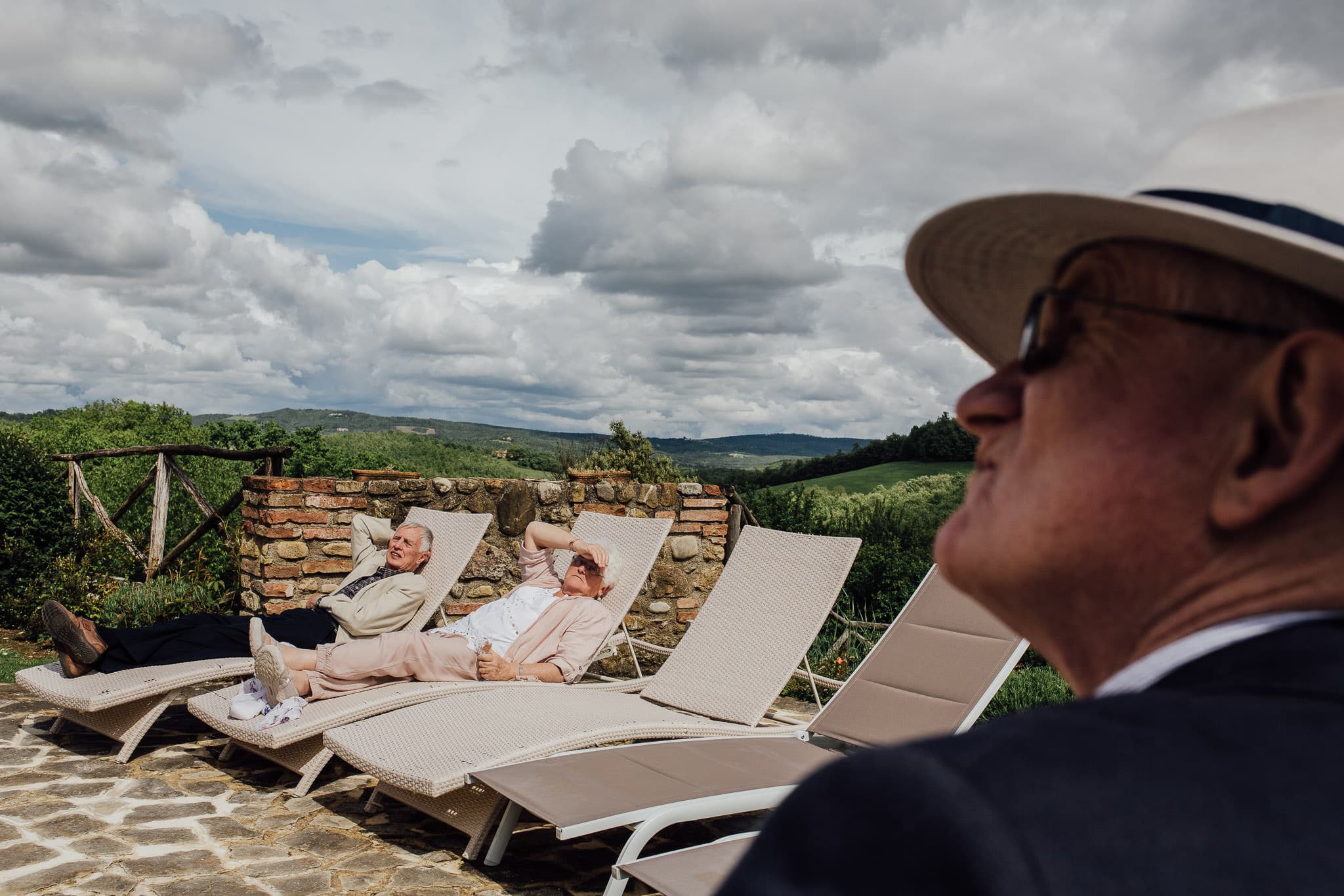 guests lounging in the sun at Tuscany wedding Villa