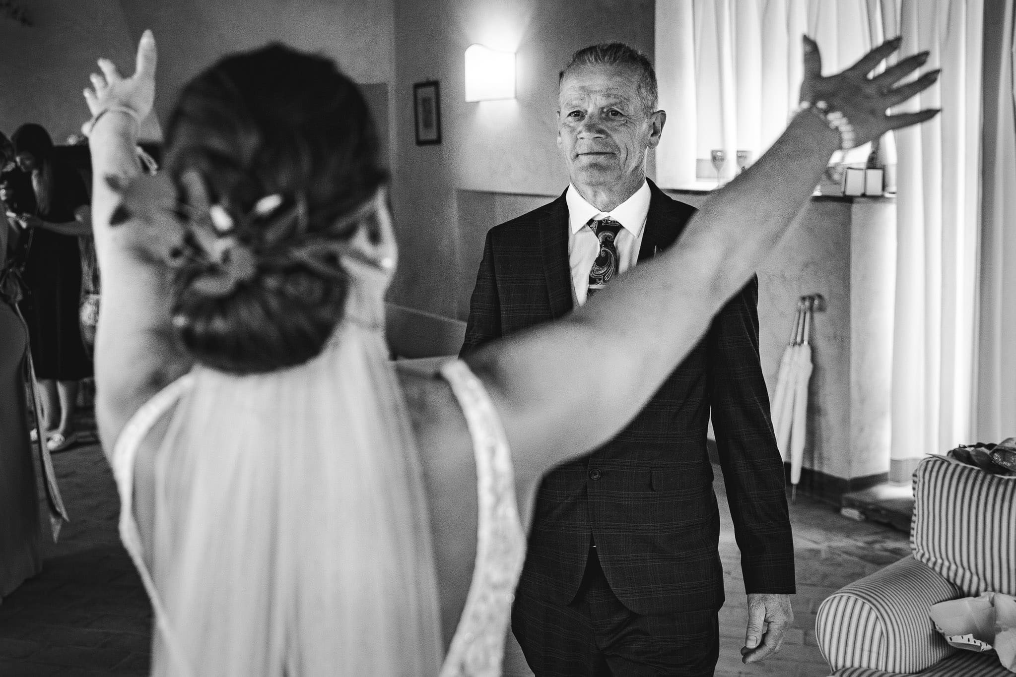 father of the bride sees dress for the first time
