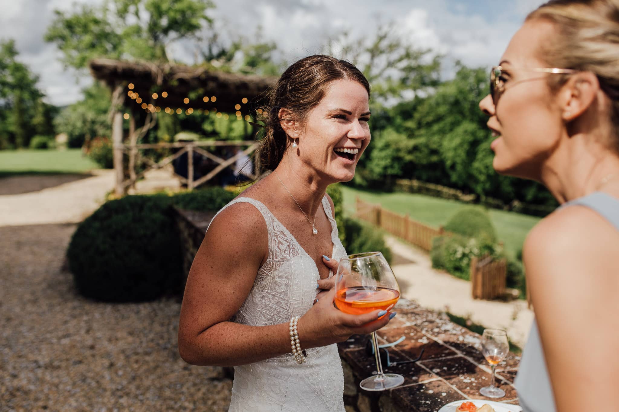 bride laughing and drinking apéros spritz