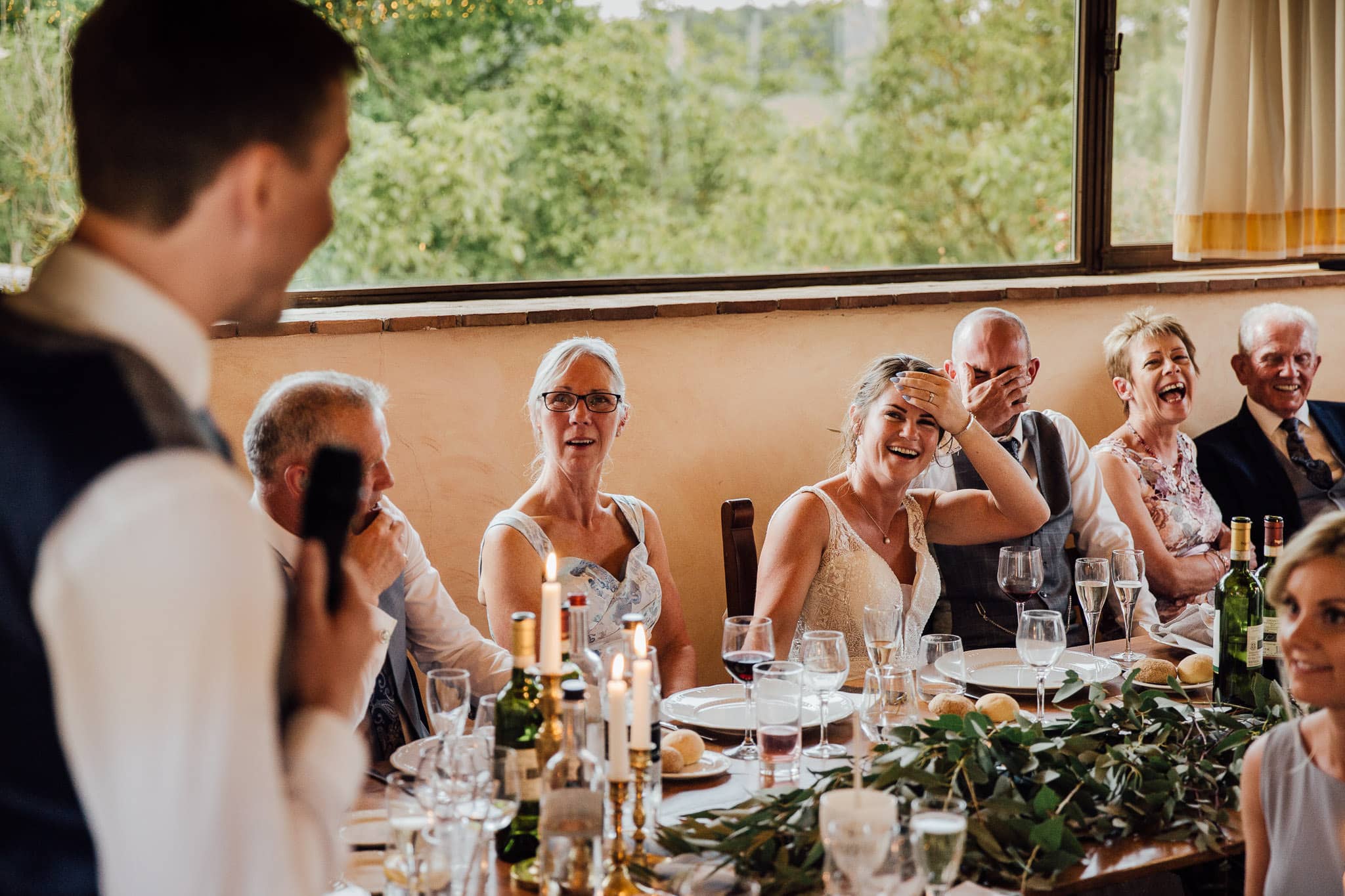 bride and groom shocked reaction during speeches