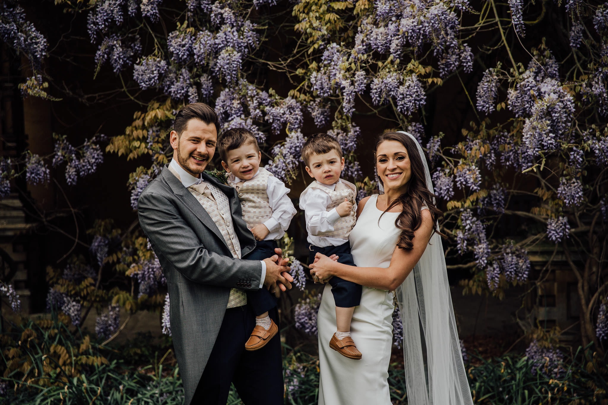 bride and groom with their twin boys