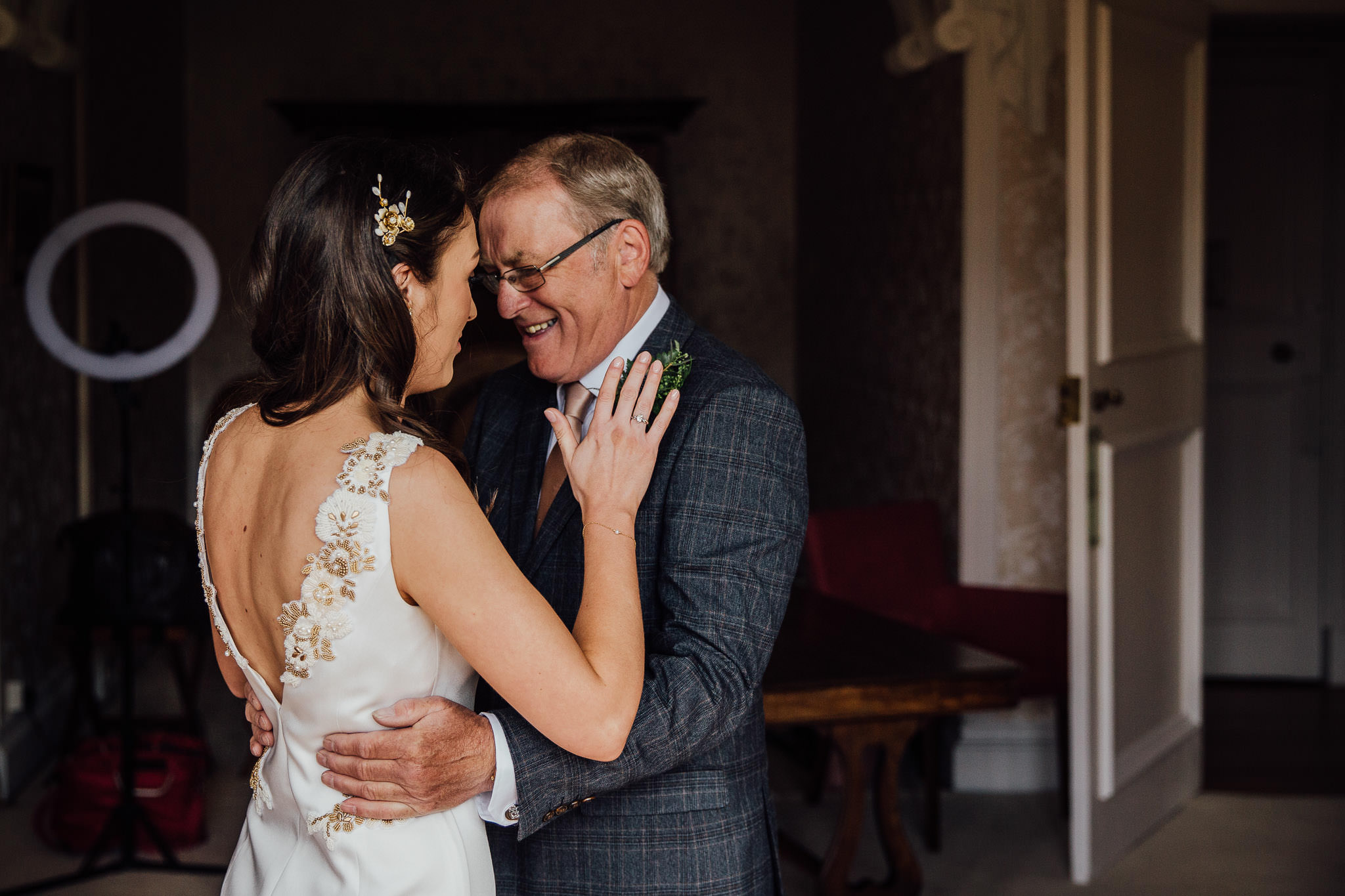 emotional Father of the Bride hugs his daughter