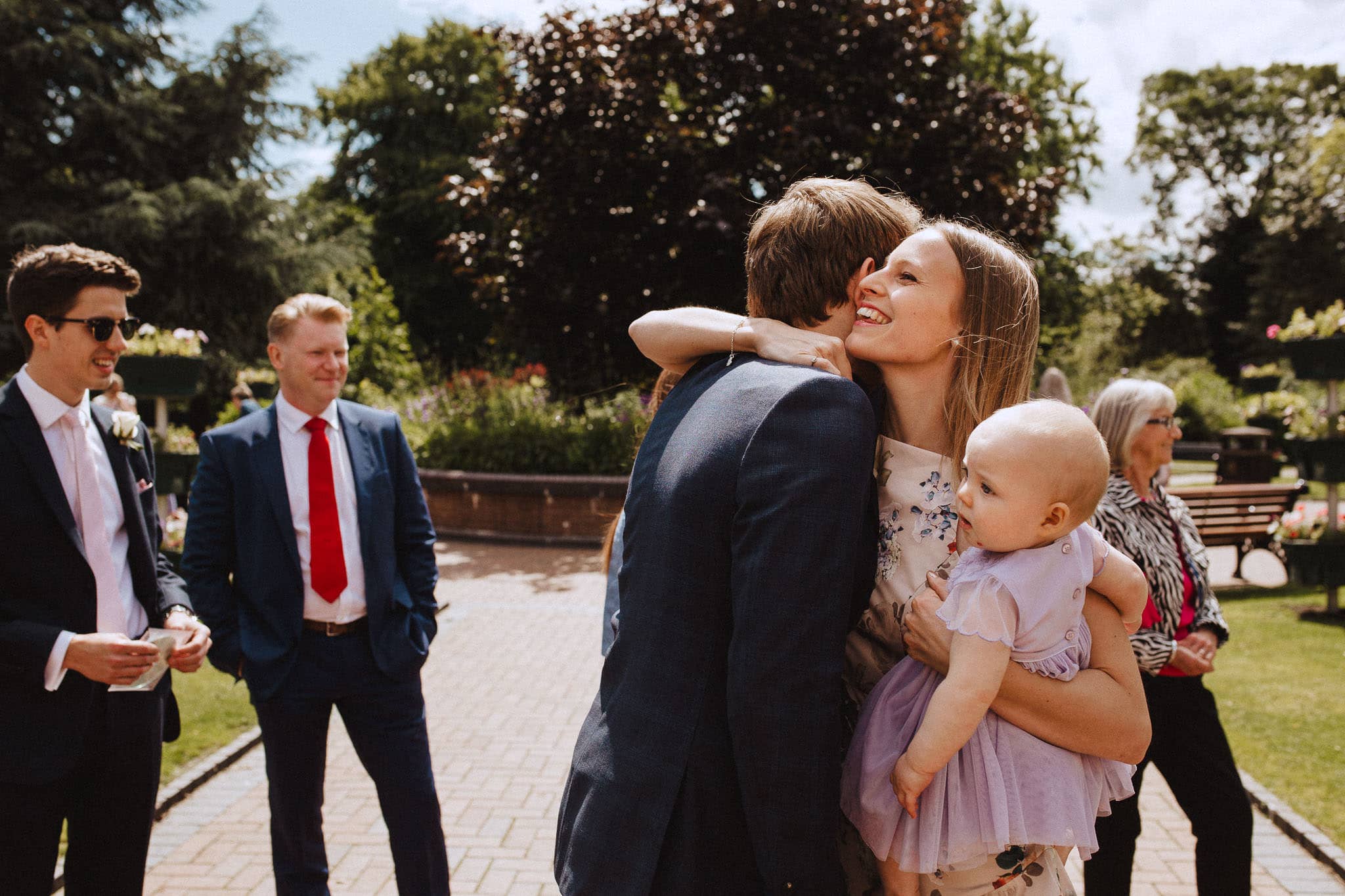 friend greets the groom on his wedding morning at Bridgford Hall