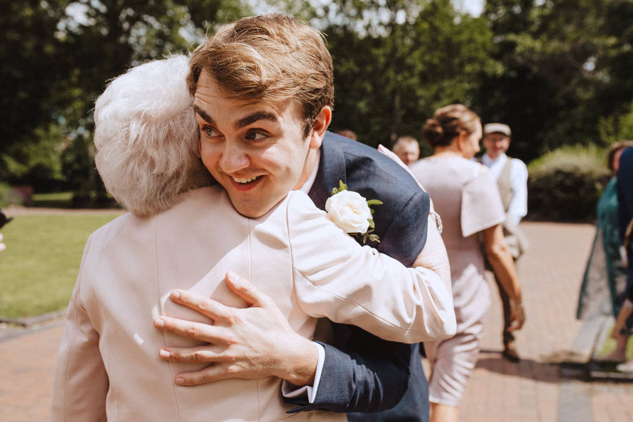 groom hugging his grandma