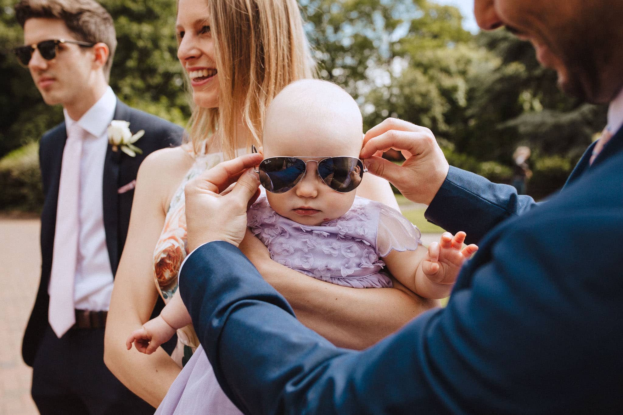 baby wearing sunglasses outside Bridgford Hall, Nottingham