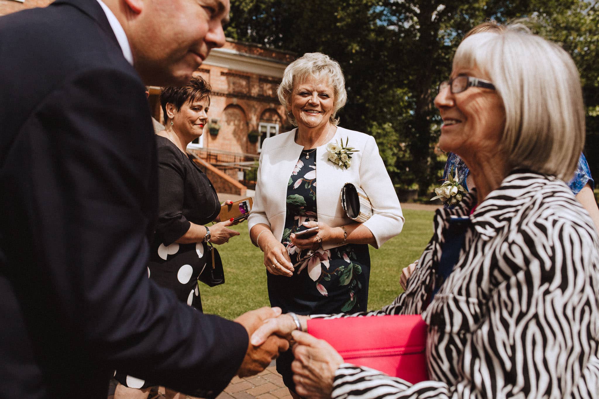 wedding guests in the park outside Bridgford Hall