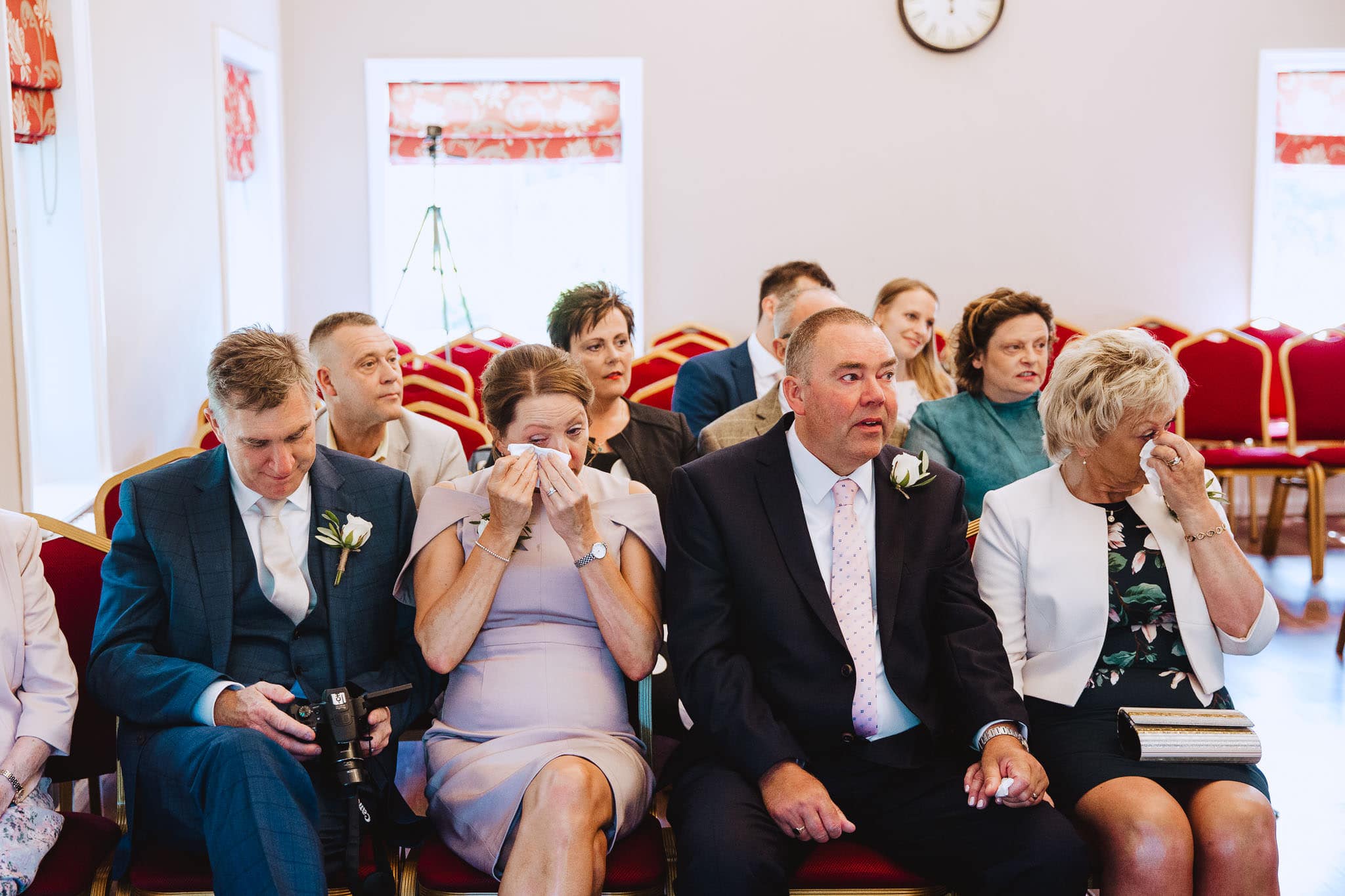 Mums wiping their tears during ceremony at Bridgford Hall