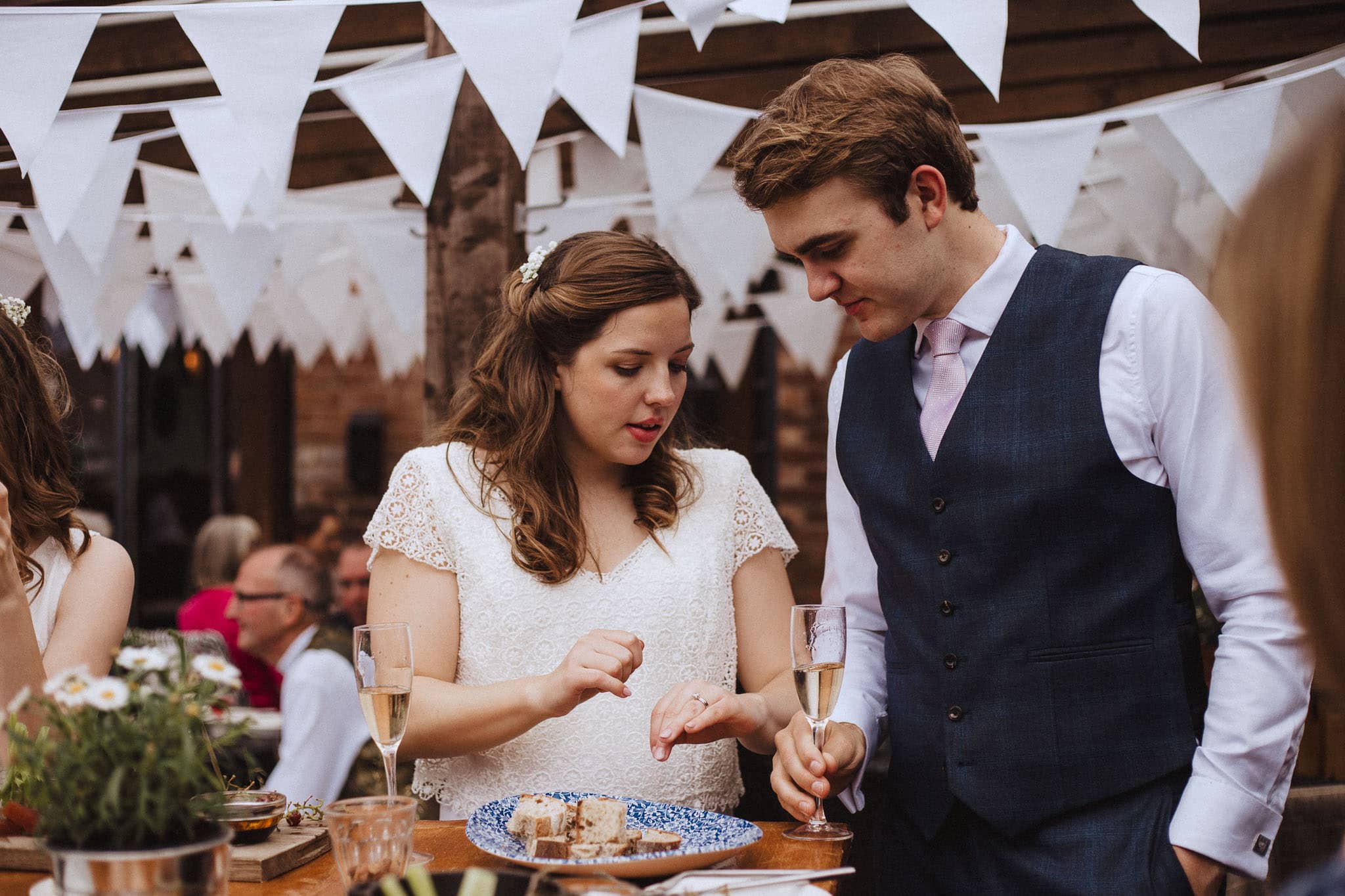 candid shot of bride and groom admiring their wedding rings