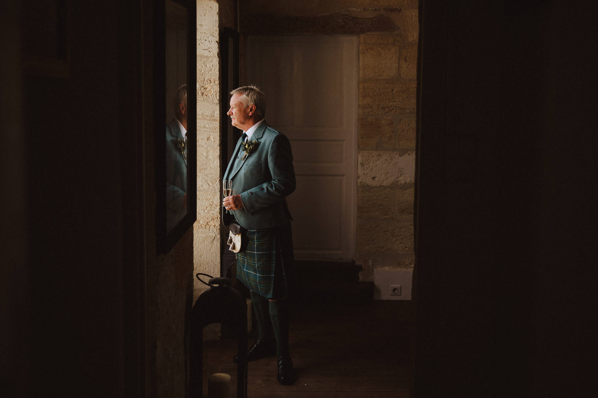 father of the bride in Chateau window light