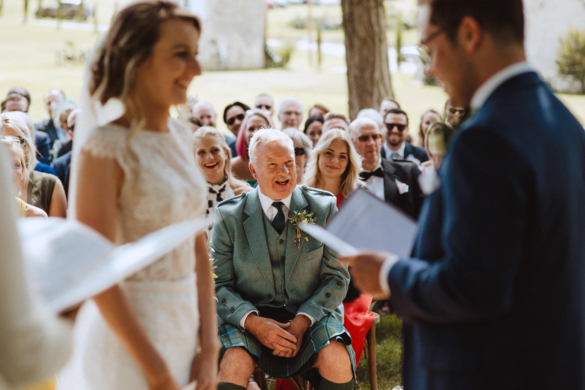 Scottish Father of the bride laughing during wedding vows