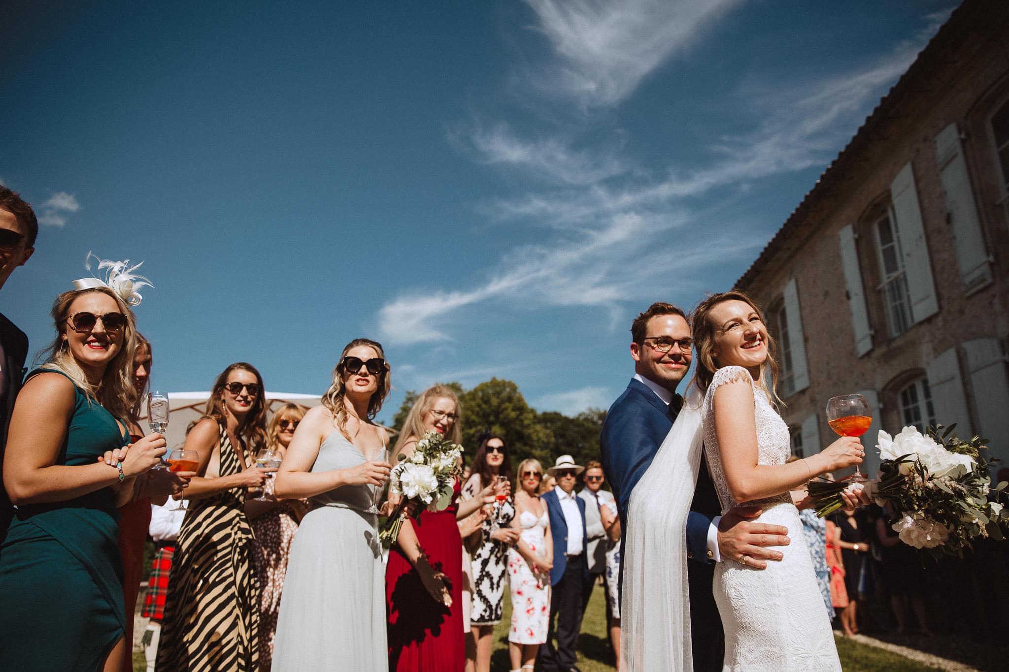 bride and groom with blue skies at their wedding in France