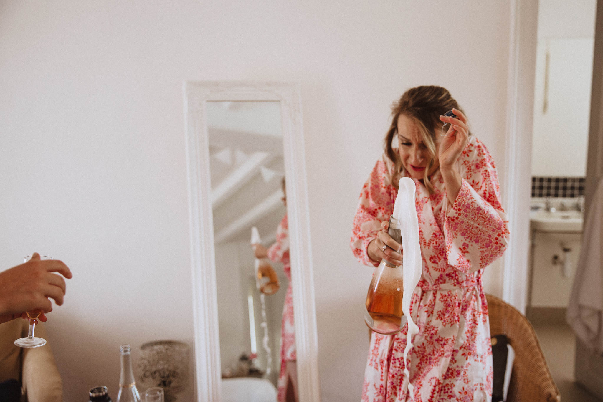 popping the champagne on her wedding morning