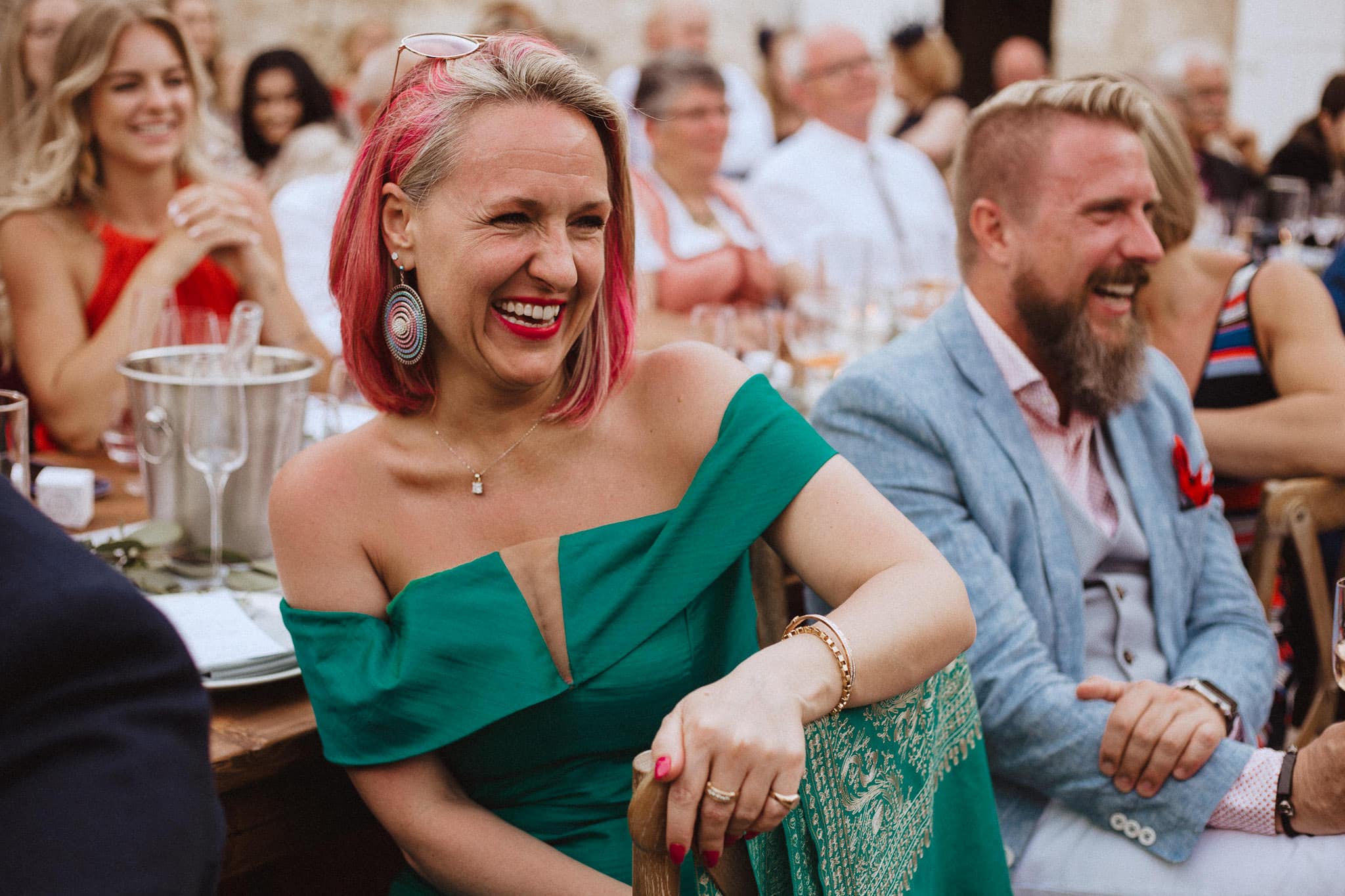 guests laughing during speeches