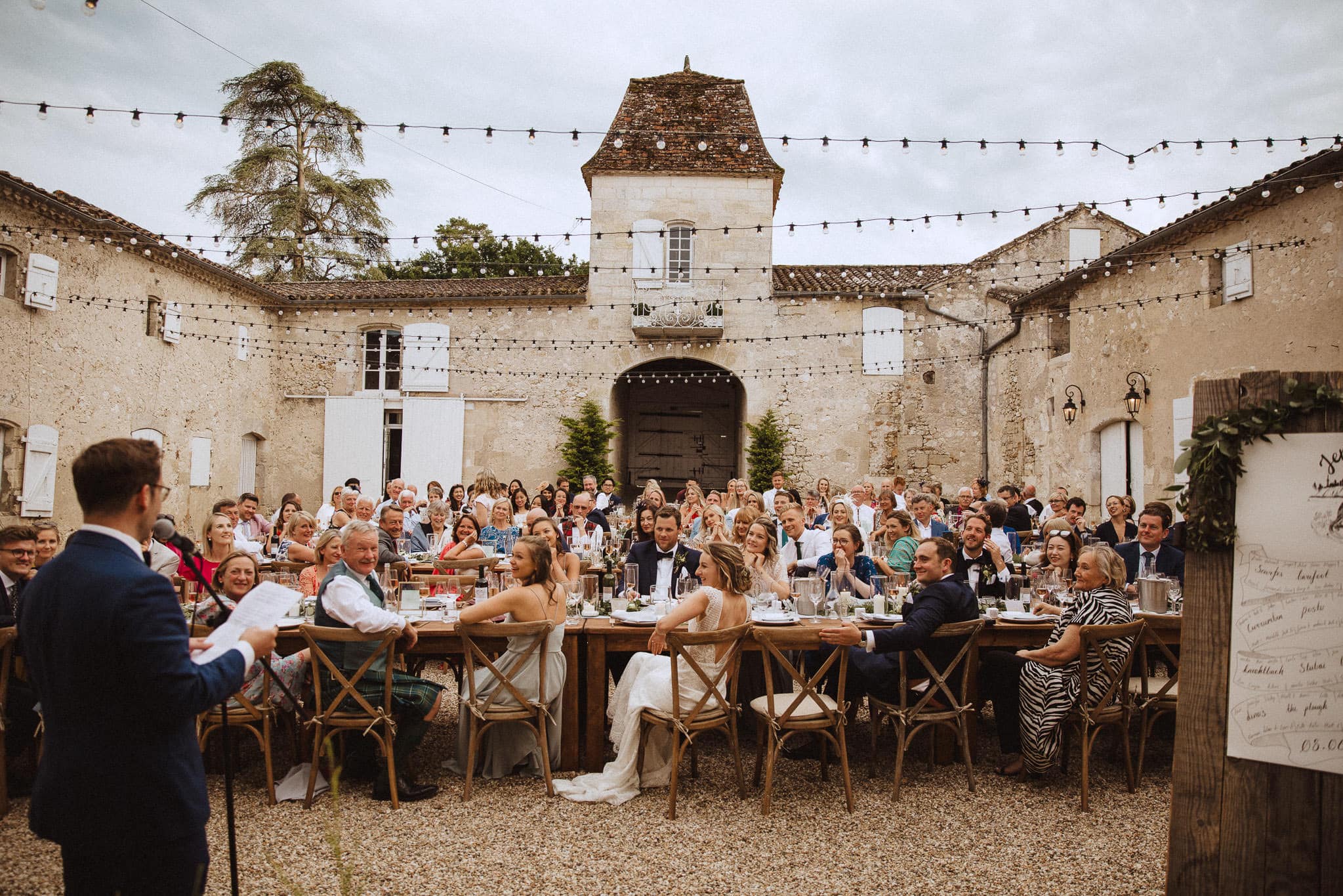 wedding meal in the courtyard at Chateau Tourbeille wedding France