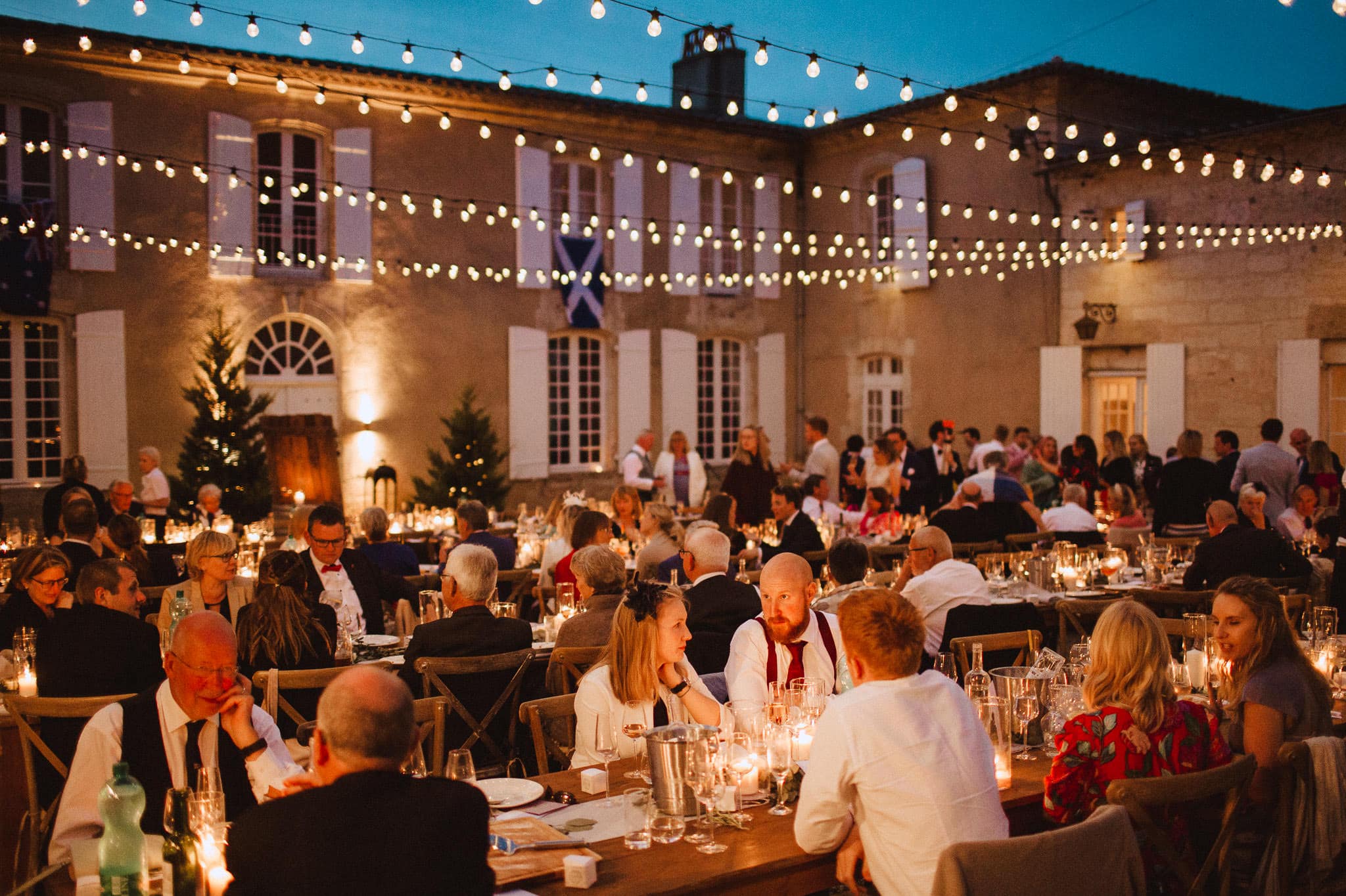 guests enjoying dinner at Chateau Tourbeille