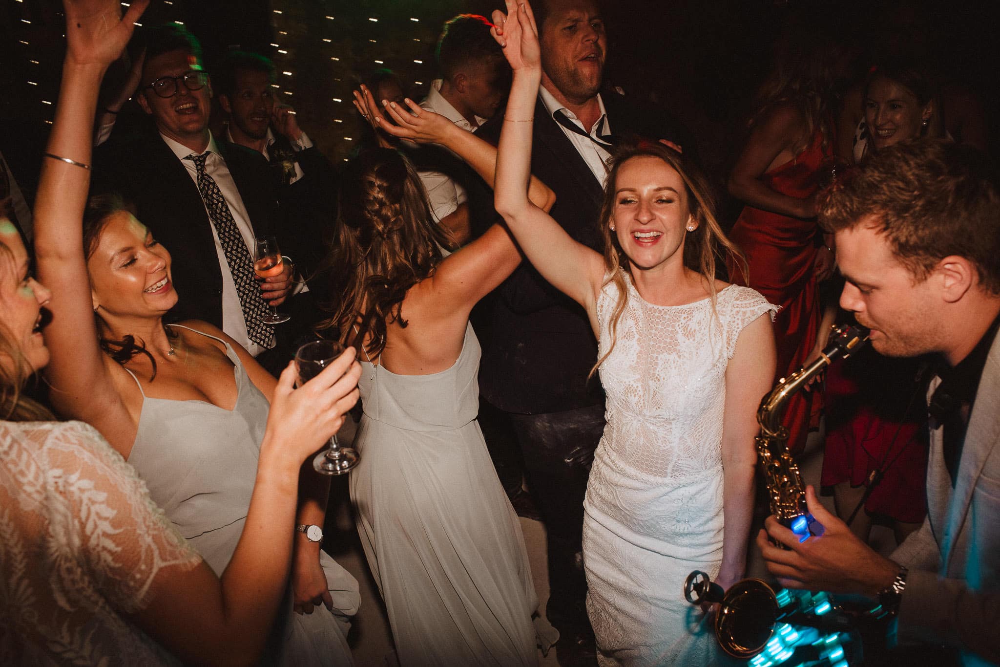 live saxophonist on the dance floor at French wedding