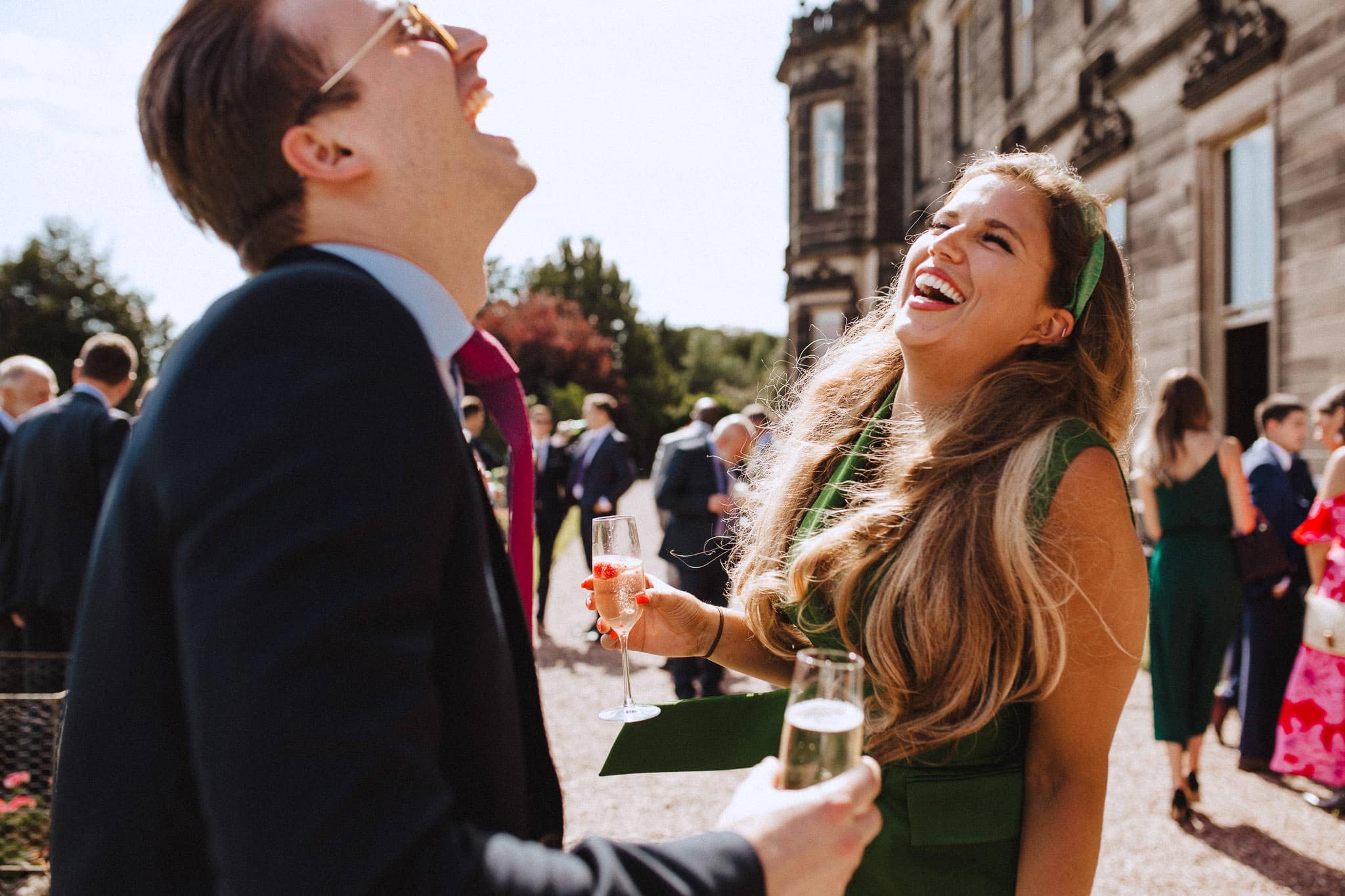 guests laughing at Sandon Hall wedding reception
