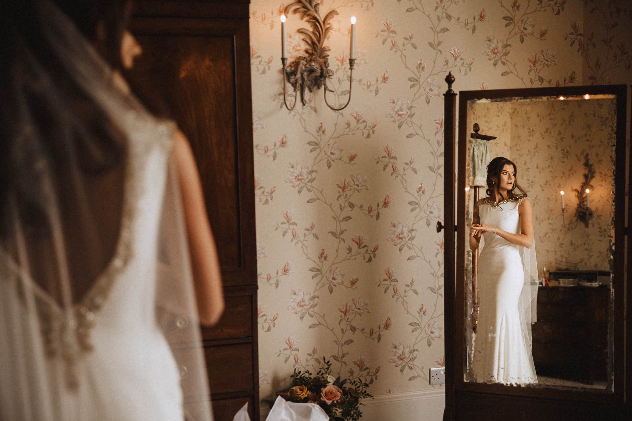 reflection of bride wearing St Patricks Pronovias gown with gold beading