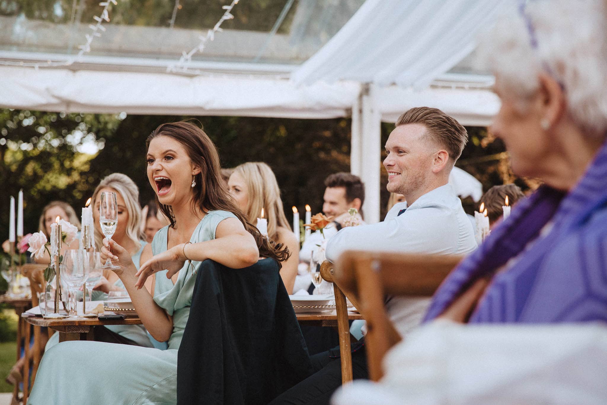 bridesmaid laughing at speech