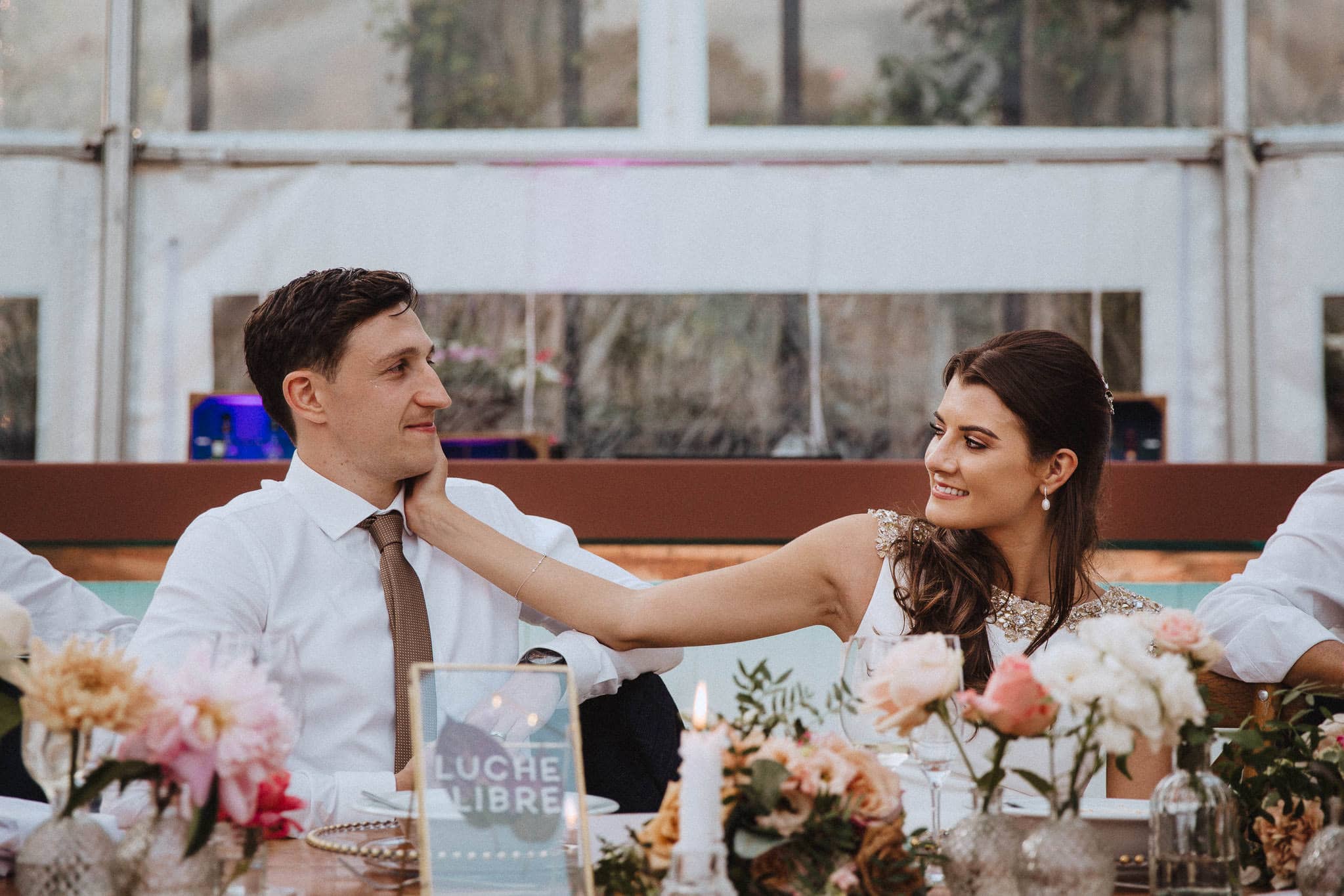 bride affectionately touches groom's face