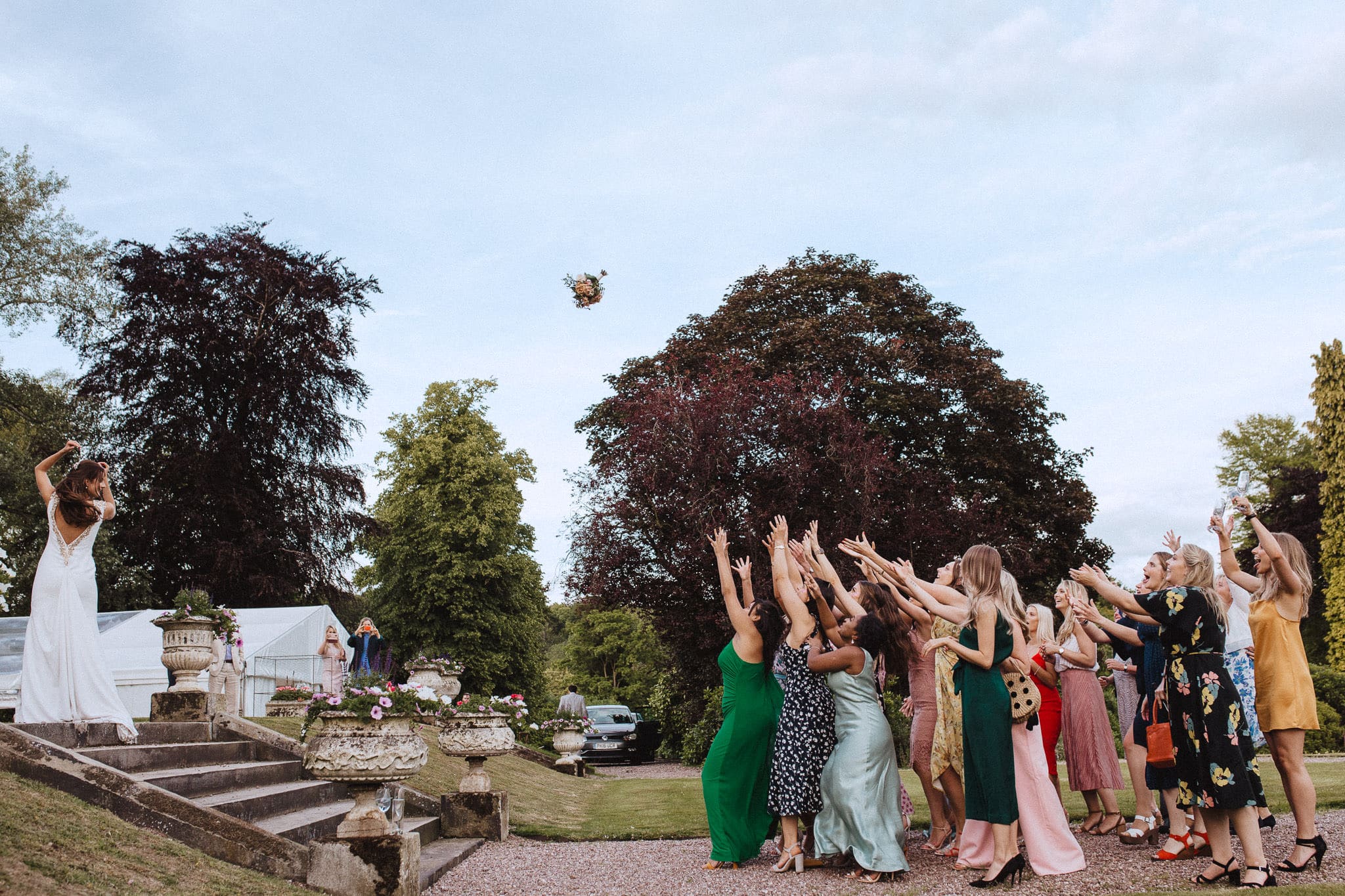 bouquet toss at Sandon Hall wedding