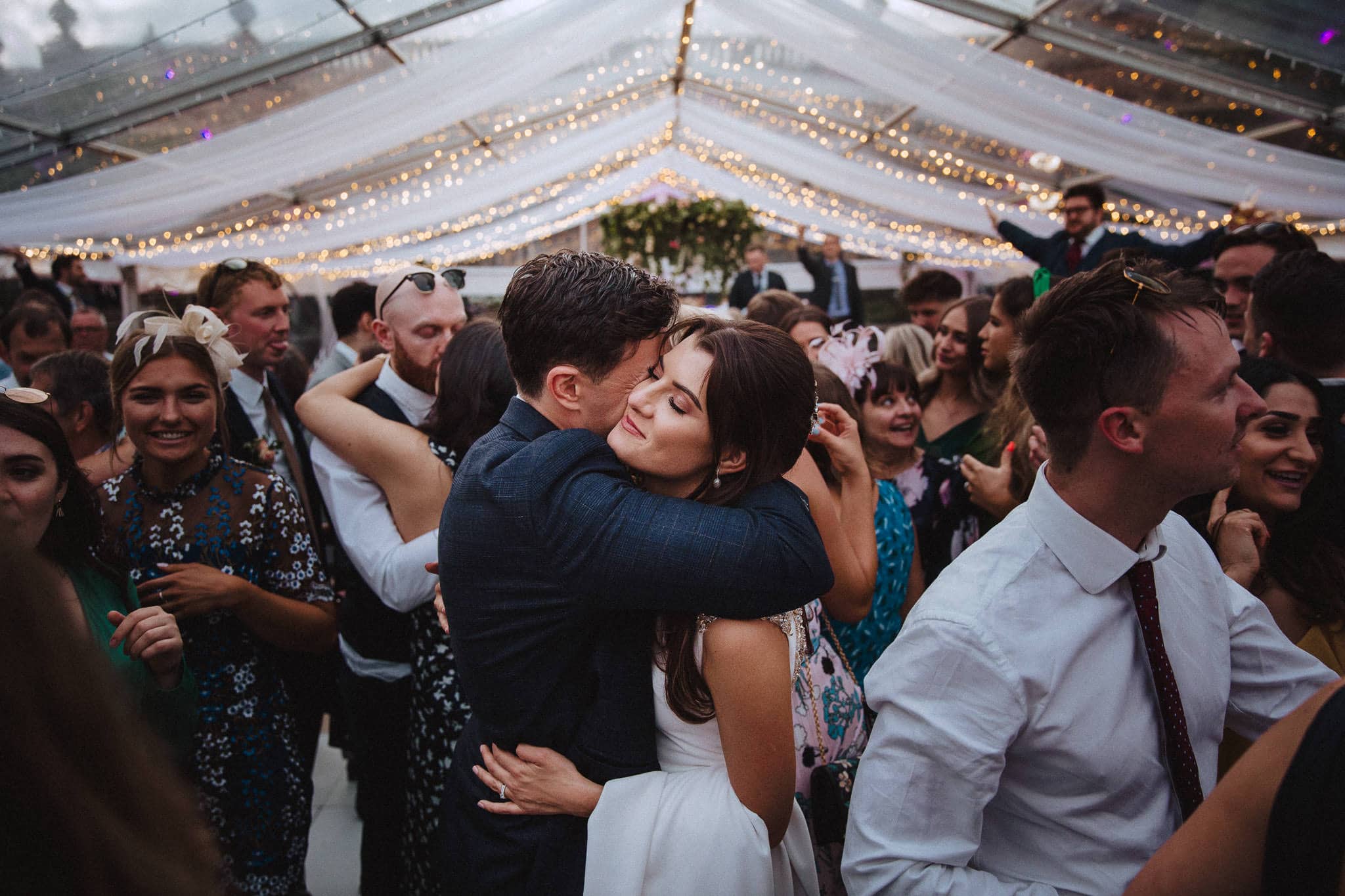 bride and groom hugging on the dance floor at Sandon Hall wedding