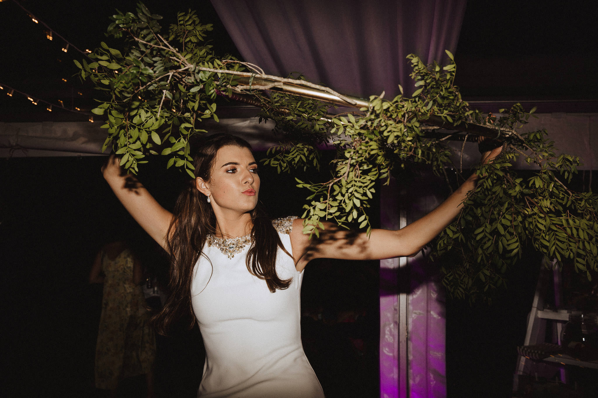 bride dancing with floral hoop