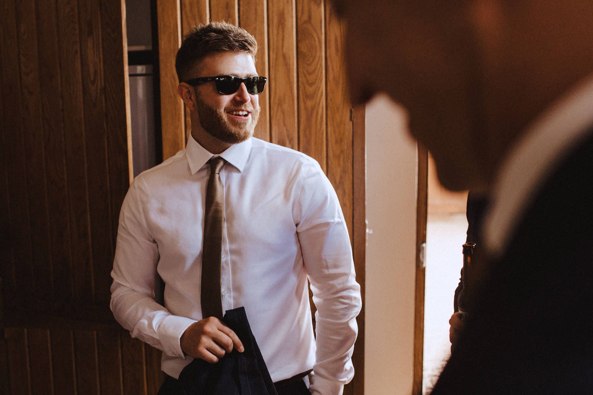 groomsman wearing ray bans