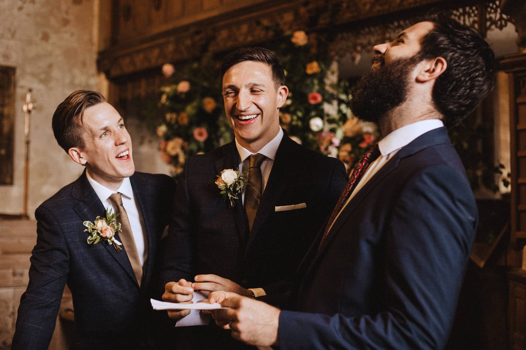 groom laughing hysterically with best man at the Church