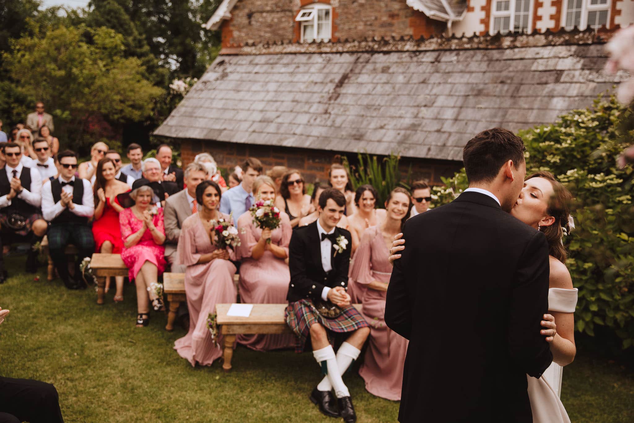 first kiss at Marquee Wedding at Home