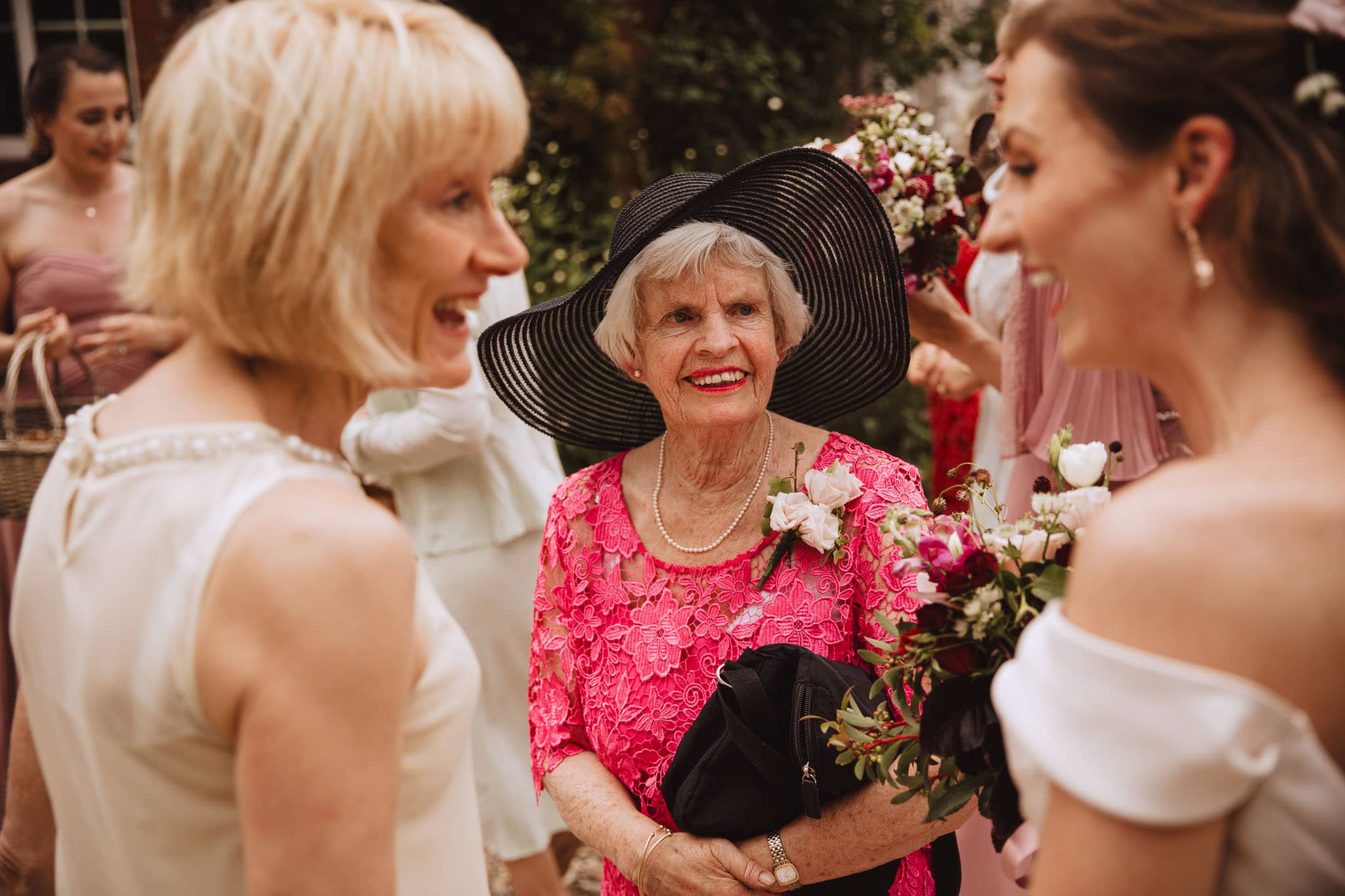 grandma admiring the bride's dress