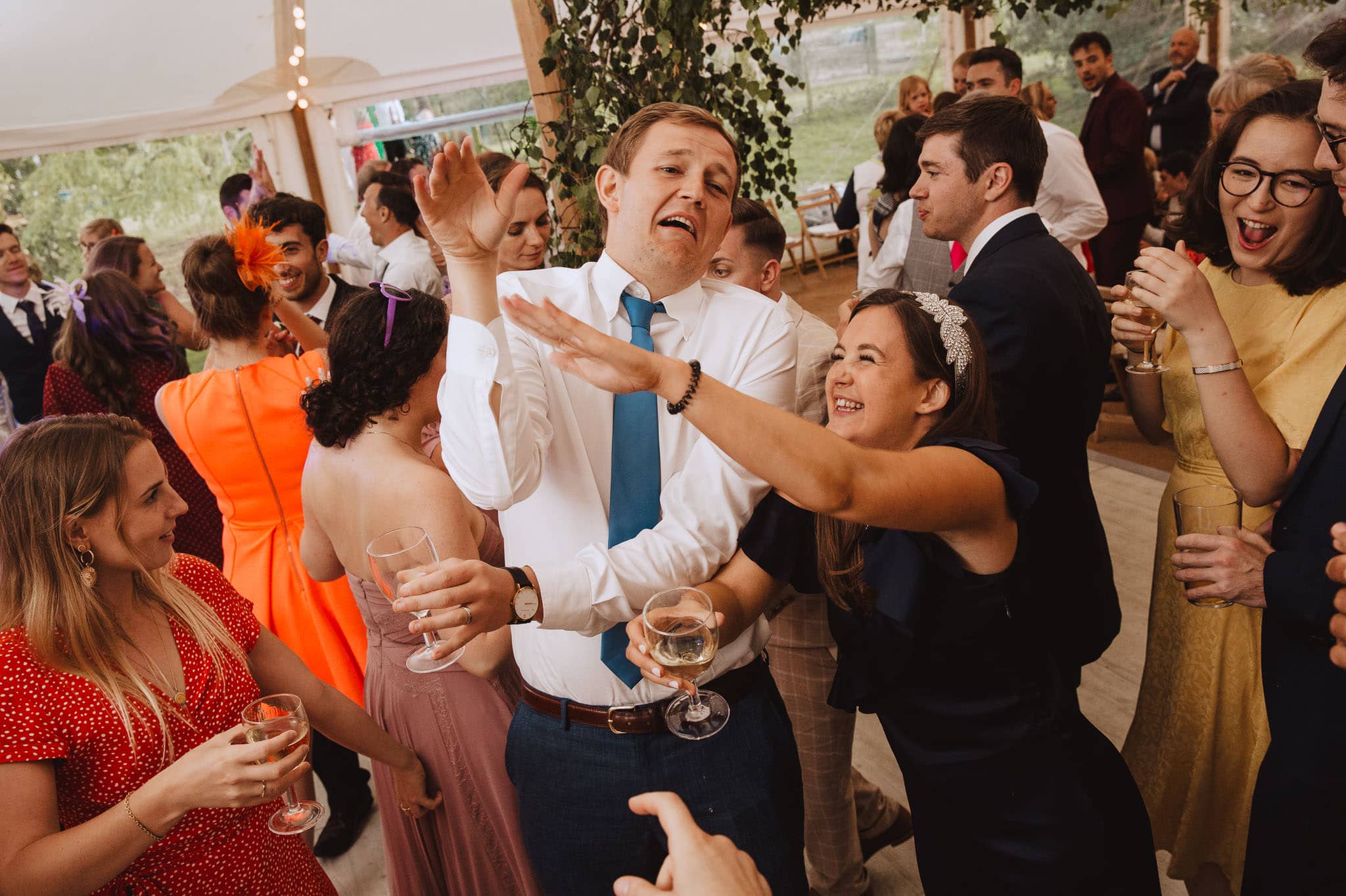 dance floor shape throwing at Marquee Wedding at Home
