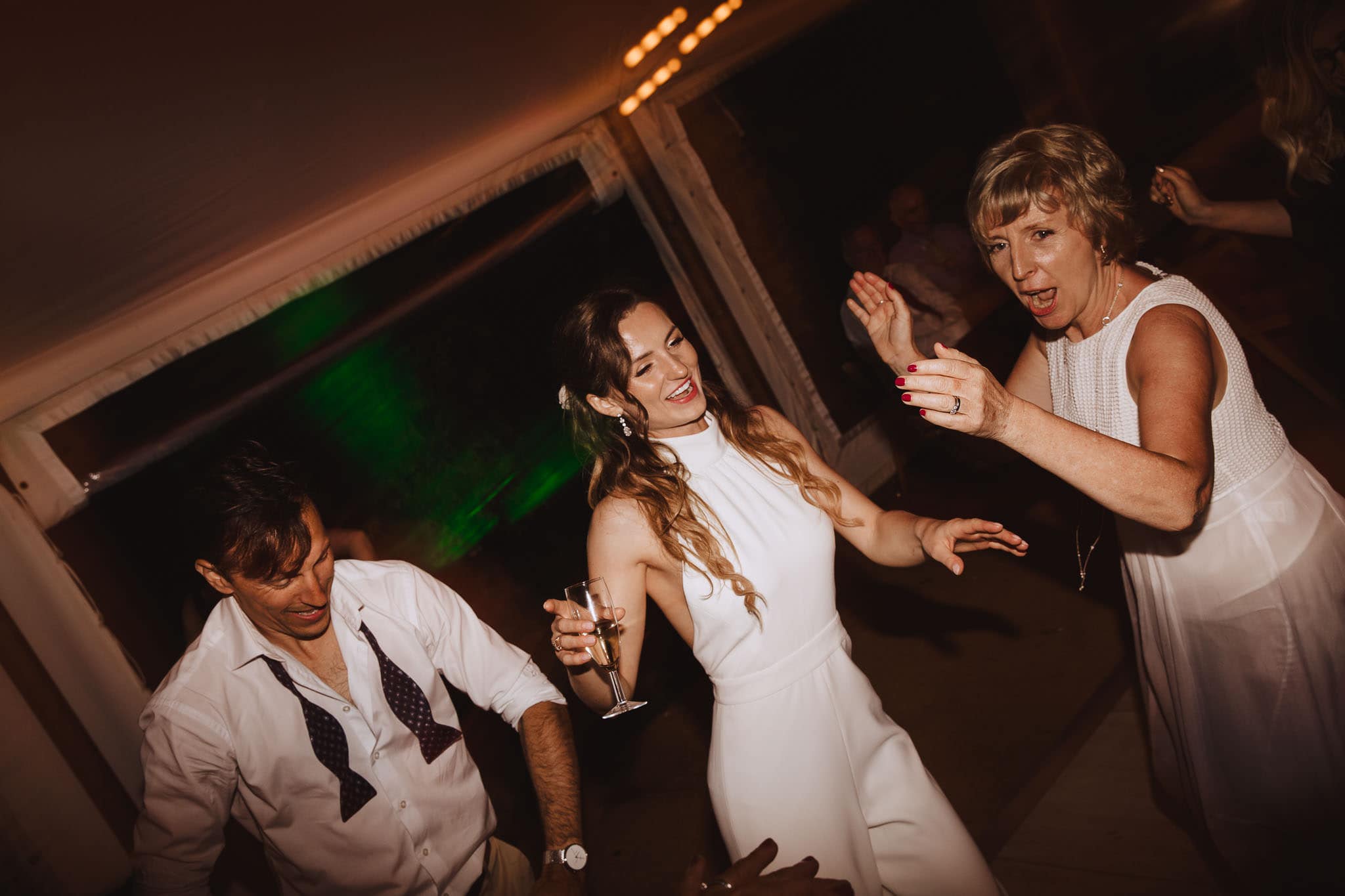 bride in white jumpsuit