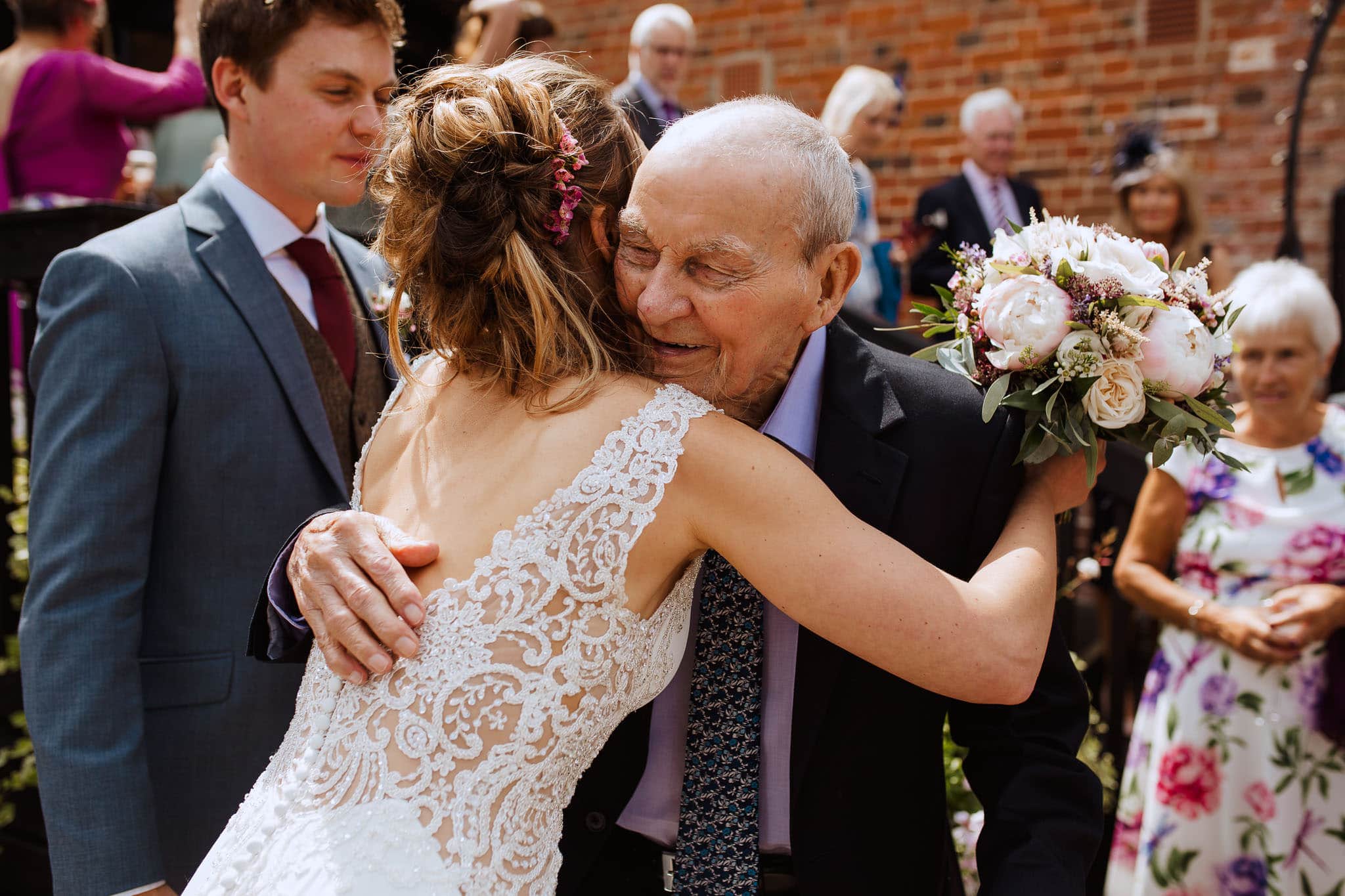 bride hugging grandad