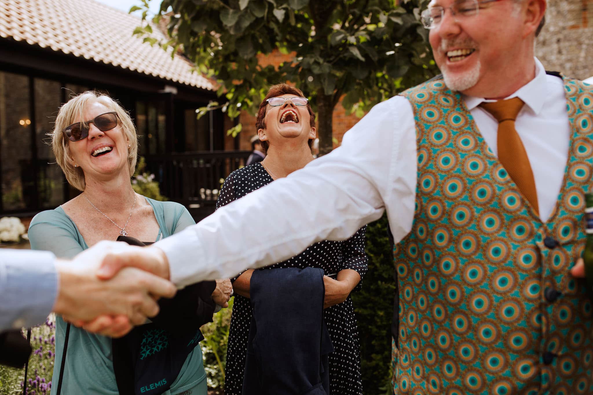 photo of guests shaking hands