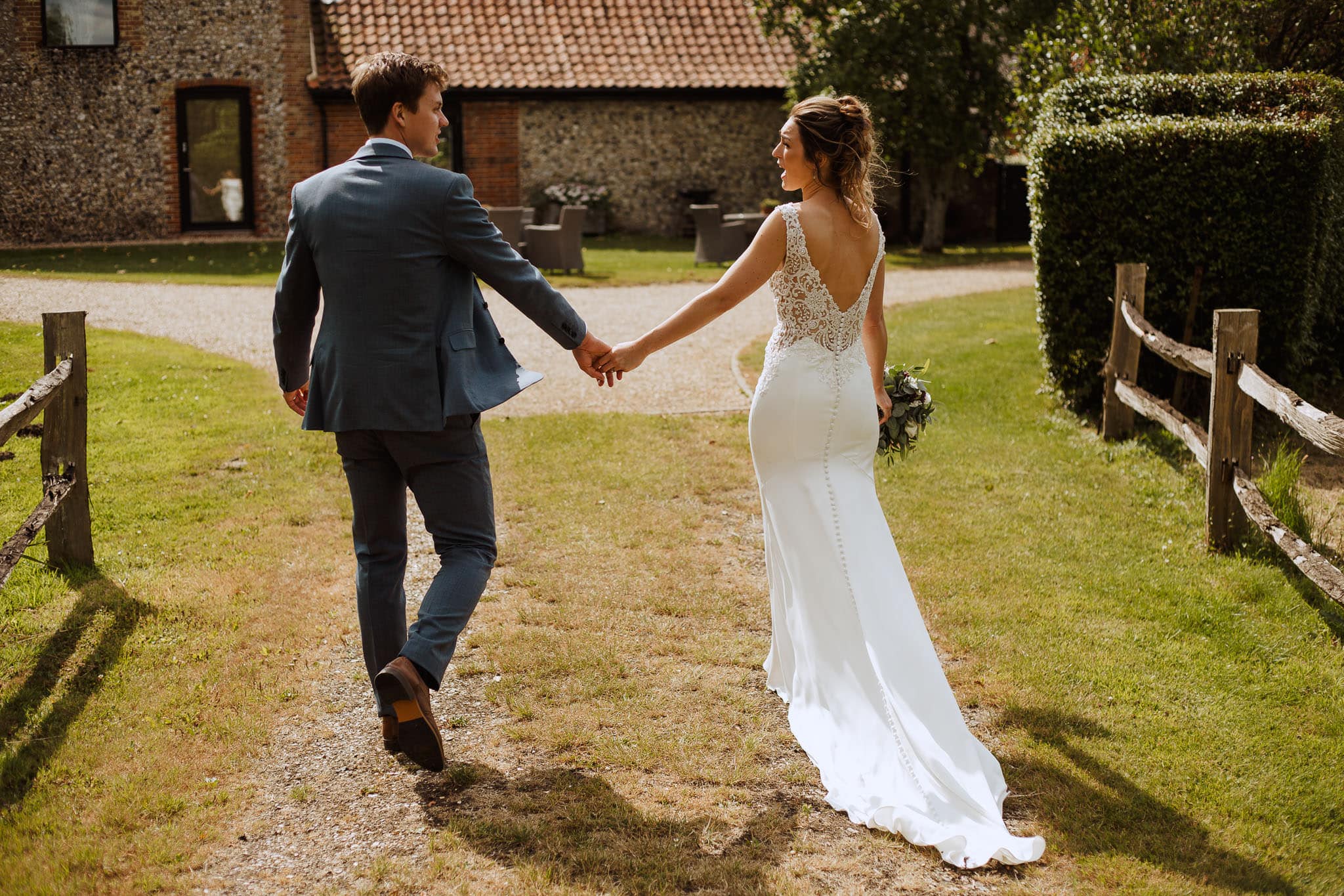 bride and groom walking at The Granary Estates Wedding