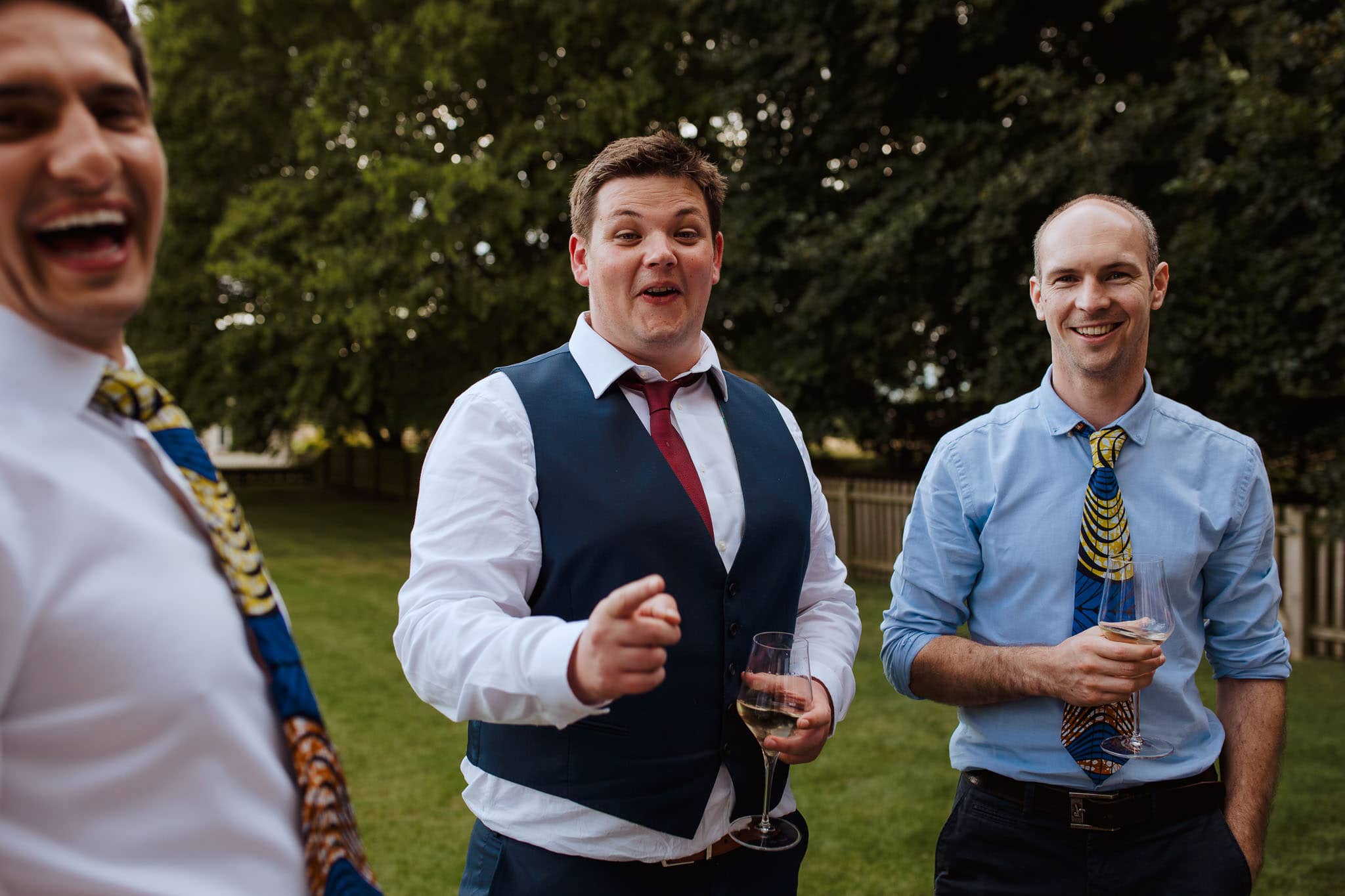 candid shot of guests laughing at The Granary Estates Wedding