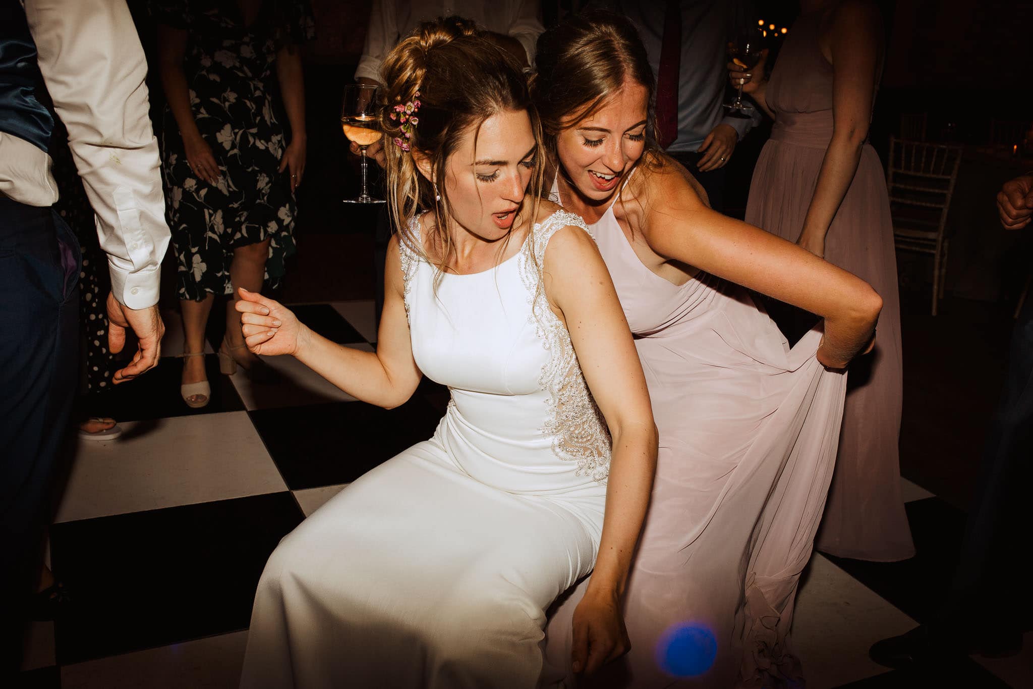 bride and bridesmaid hot the dance floor