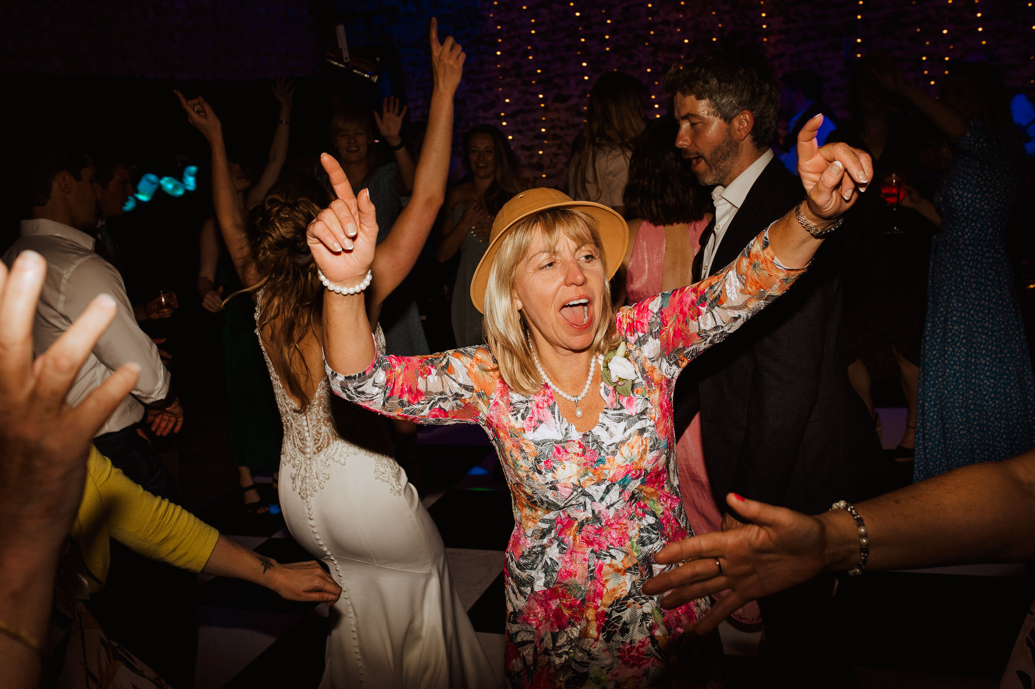 mother of the groom having fun on the danced floor